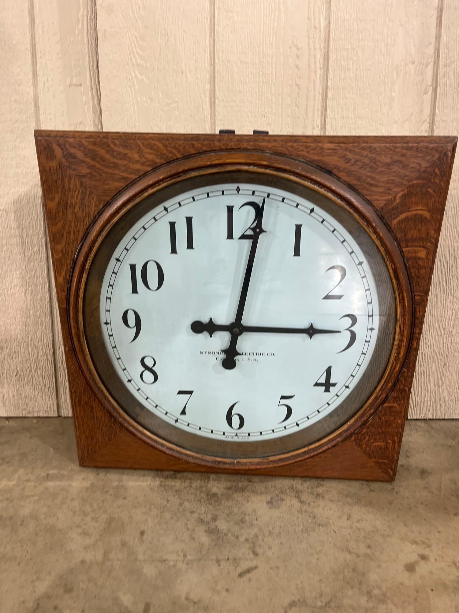 Stromberg Electric Oak Industrial Clock: 22.5x22.5 An industrial secondary wall clock manufactured by the Stromberg Electric Co. of Chicago, Illinois. The square case is constructed of quarter sawn oak and features a hinged front door. The