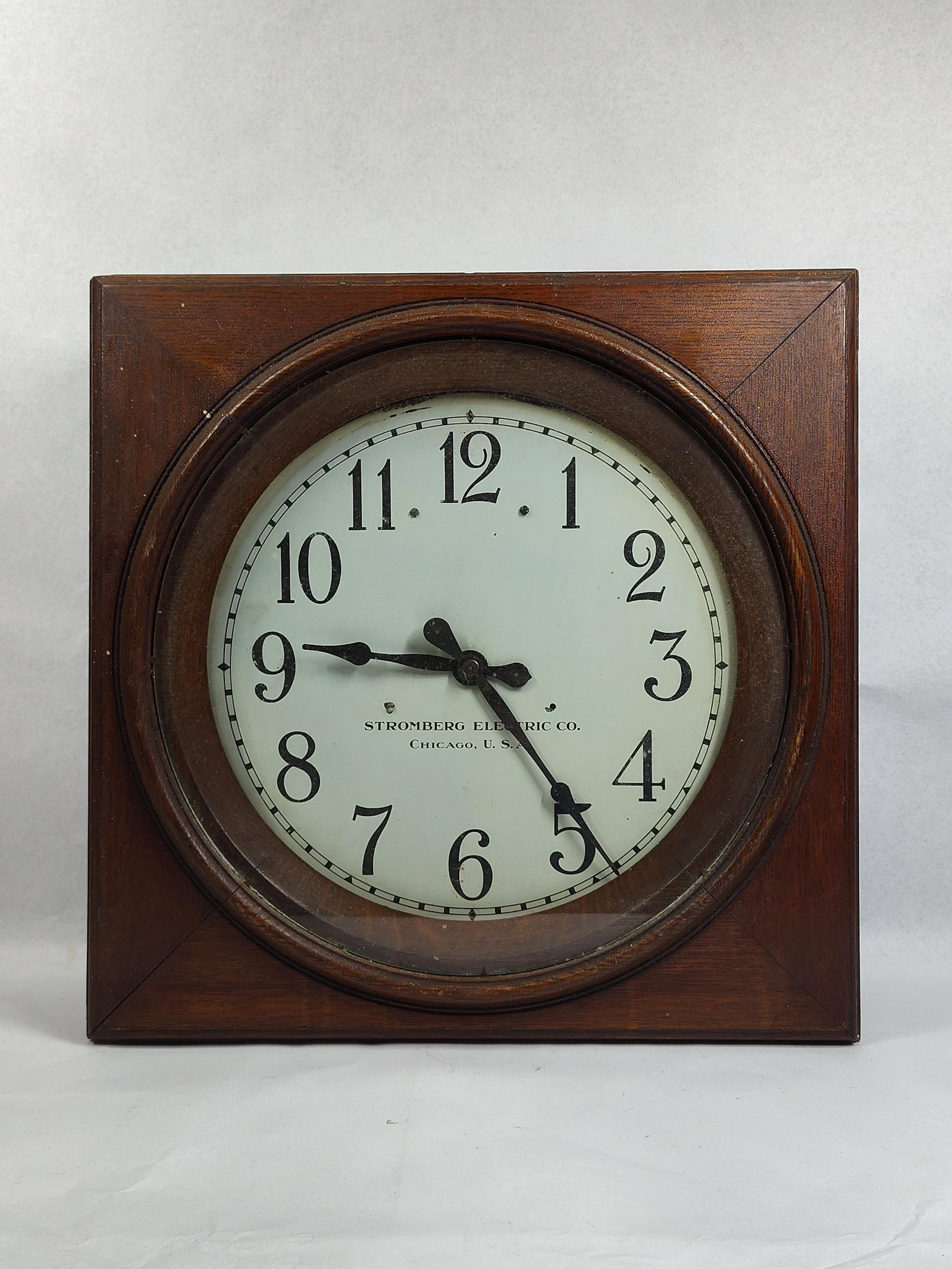 Stromberg Electric Wood Secondary Clock: 17x17x5 This vintage industrial or office wall clock was manufactured by the Stromberg Electric Co. of Chicago. It is housed in a square wooden case with mitered corners and a circular glass-covered d