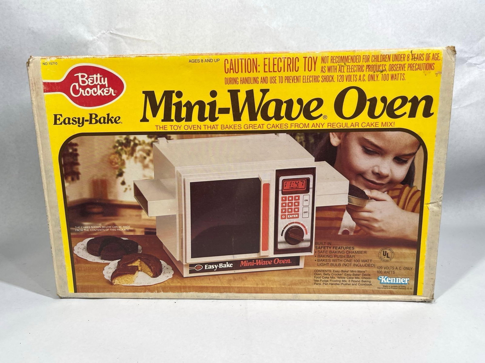 Kenner Easy-Bake Mini-Wave Oven w/ Box: This vintage new old-stock Betty Crocker Easy-Bake Mini-Wave Oven, model number 15710, was manufactured by Kenner, a division of CPG Products Corp., in 1982. The toy oven is styled after a contemporar