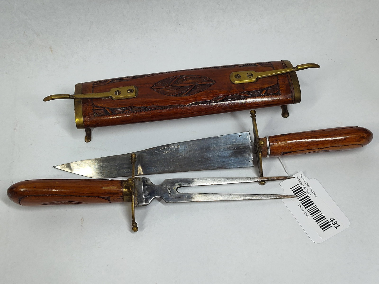 Indian Wood & Brass Carving Set w/Stand: 18in long A vintage two-piece carving set of Indian origin, consisting of a fixed-blade carving knife and a matching meat fork, housed within a specialized dual-entry wooden scabbard that doubles as a