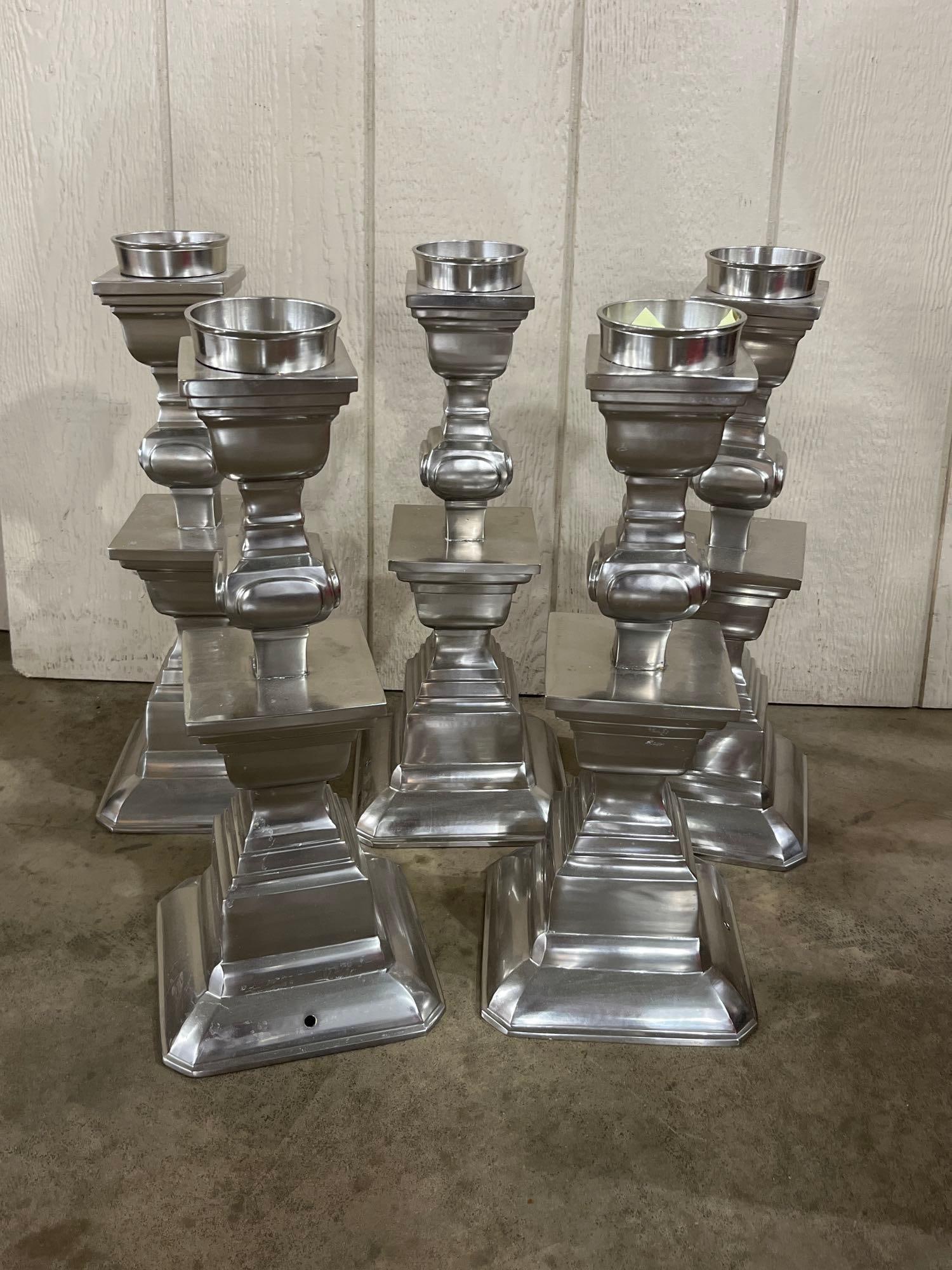 Set Six Aluminum Pillar Candle Holders: 21in A set of six tall pillar candle holders in a traditional neoclassical style. Each piece is constructed from cast metal, likely aluminum, featuring a brushed satin silver-tone finish. The design