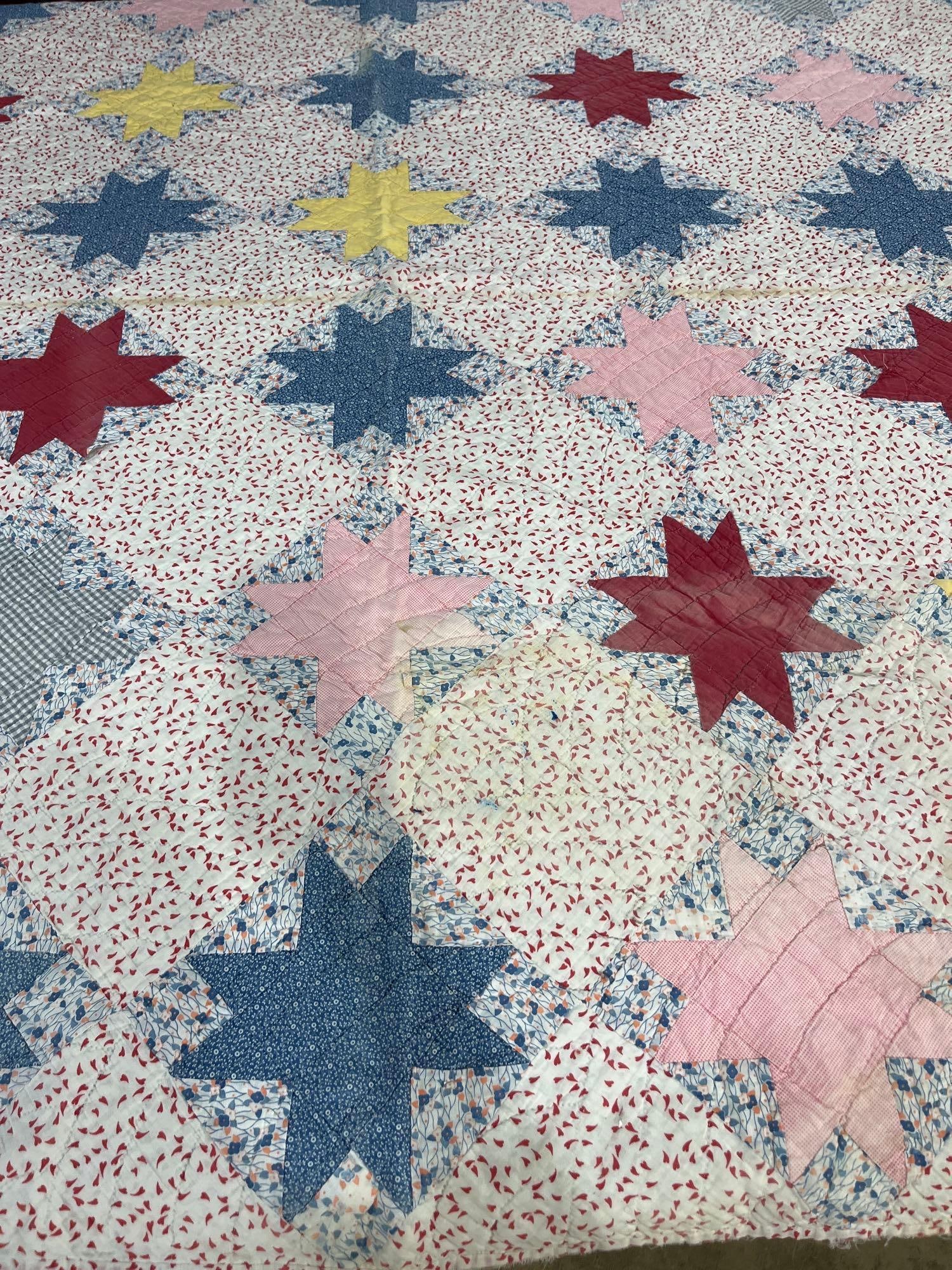 American Eight-Point Star Cotton Quilt: 79x67 This is a vintage American cotton quilt, hand-pieced and hand-quilted in a variation of the eight-pointed star pattern. The design features star motifs arranged in a grid against a white