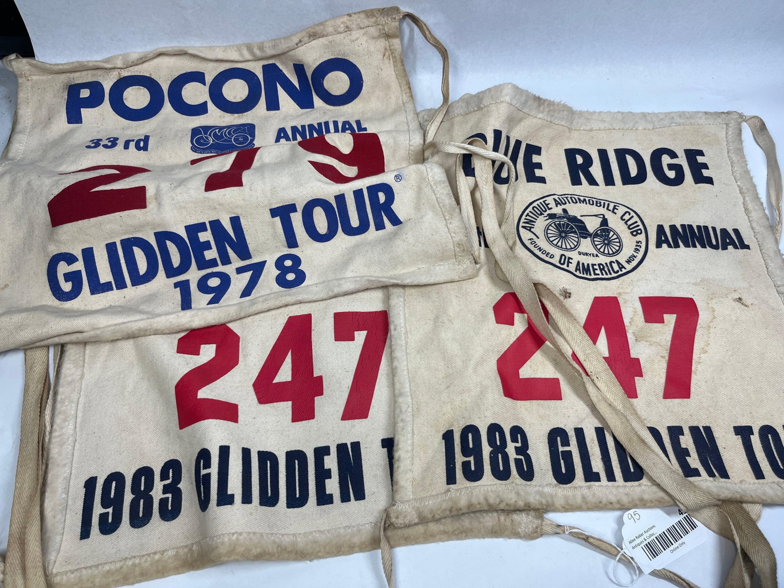Trio Glidden Tour Radiator Banners: A trio of vintage event banners designed for mounting to the radiator grilles of participating vehicles during the Glidden Tour. The lot includes one banner from the 33rd Annual Glidden Tour held in