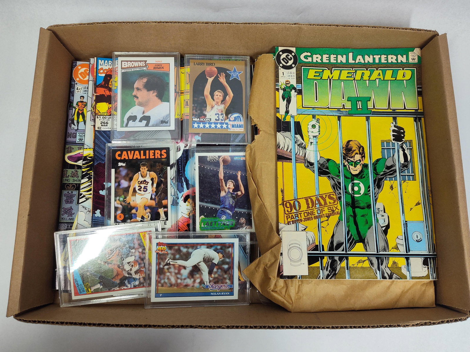 6 Sports Trading Cards & Modern Comics: This lot consists of six sports trading cards and an assortment of approximately 15 comic books from the late 1980s and early 1990s. The sports trading cards are individually housed in protective