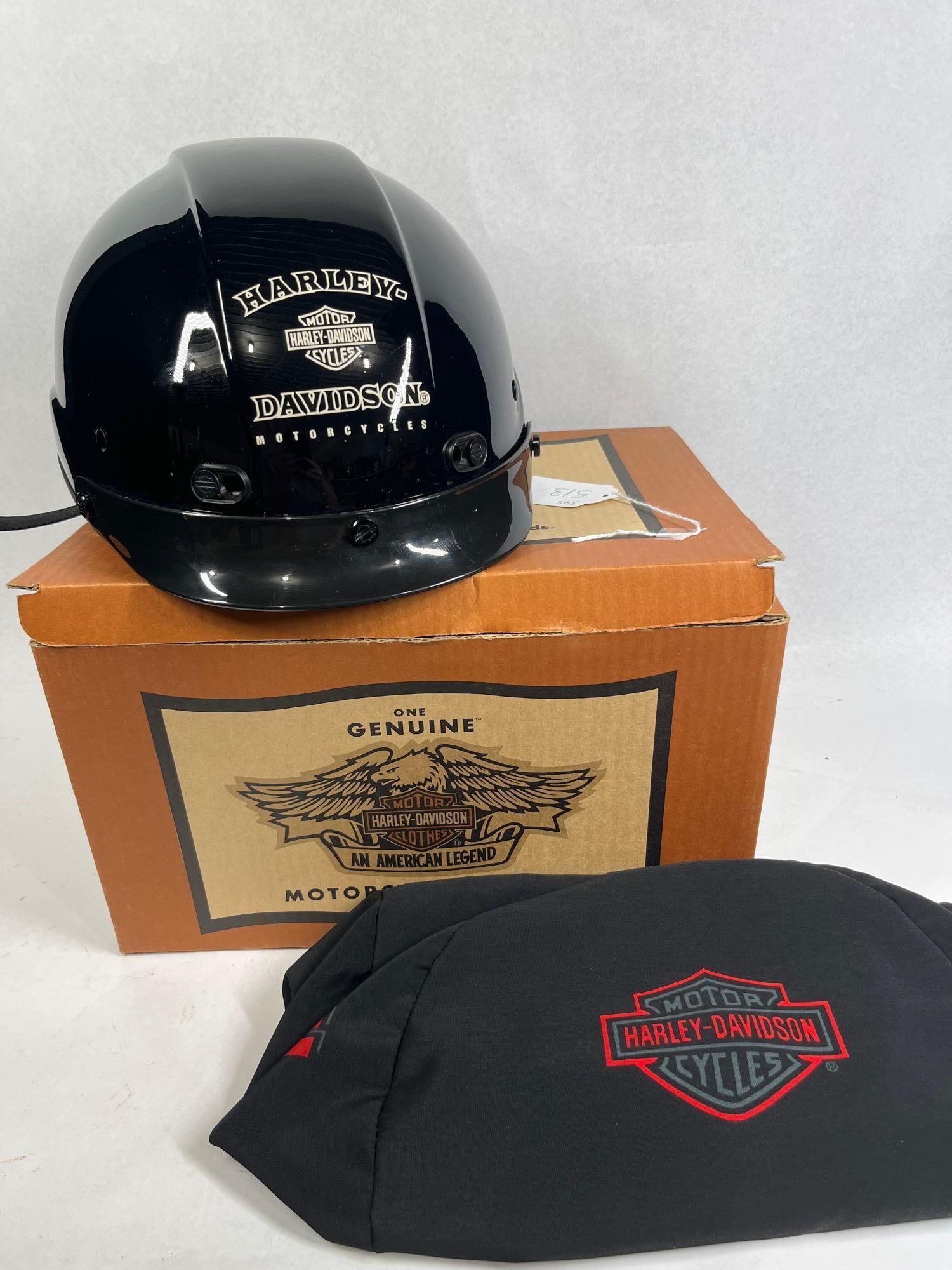 Harley-Davidson Darkstar Half-Helmet: A genuine Harley-Davidson Darkstar motorcycle half-helmet featuring a high-gloss black composite shell. The forehead area is decorated with white graphics including the Bar and Shield logo and the