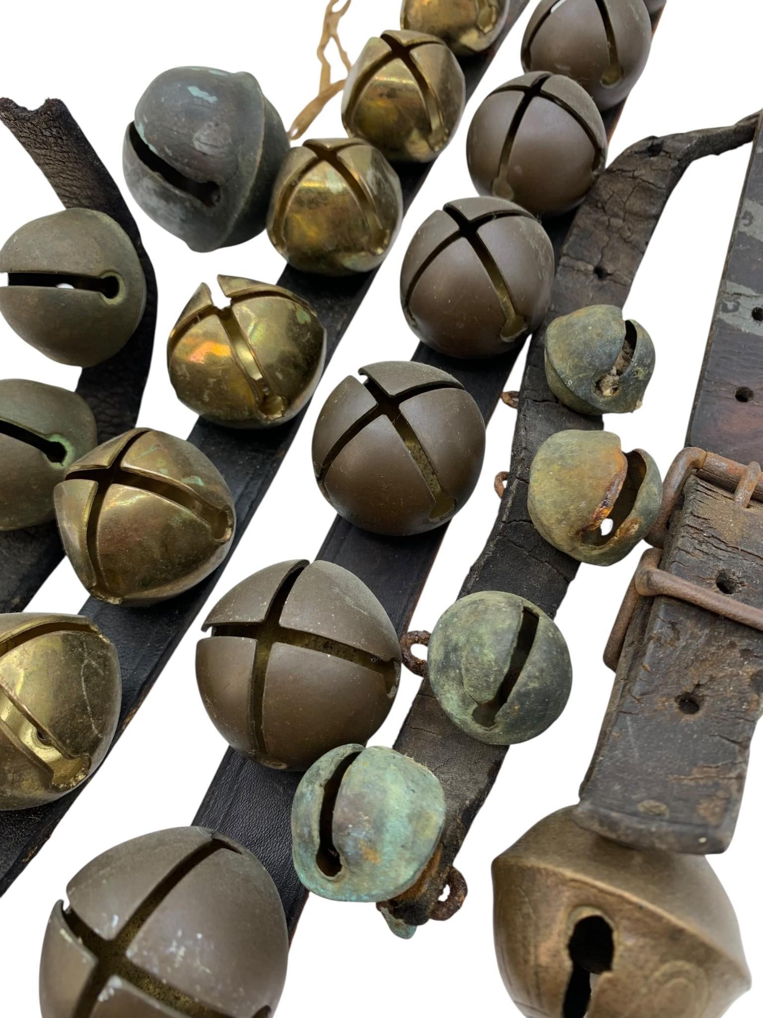 6 pc Antique to Vintage Winter Holiday Sleigh Bells Collection: Leather straps with some age and wear to the antique pieces, 21" to 8" lengths, 2 3/8" to 1" brass and metal bells, musical ringing.