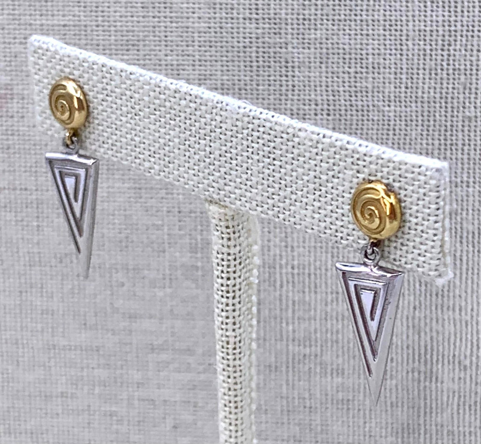 Edgy 18k Yellow Gold & Sterling Silver Pierced Spiral Spike Earrings: 18k hallmarked spiral stud, Fleur-de-lis letter C inside of a shield Fleur-de-lis 925 hallmarked triangular spike dangle, 1" total length, 3.2 gram combined weight, 925 hallmarked backs.