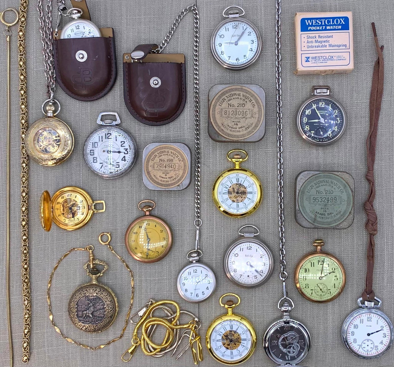 22 pc Vintage Pocket Watch and Watch Chain Collection: The quartz models need fresh batteries, one Elgin runs (serial # 18230418) with a B&B 20 yr warranted case with a missing bow, the Arnex skeleton face has 17 jewels with a missing crown, one Elgin has