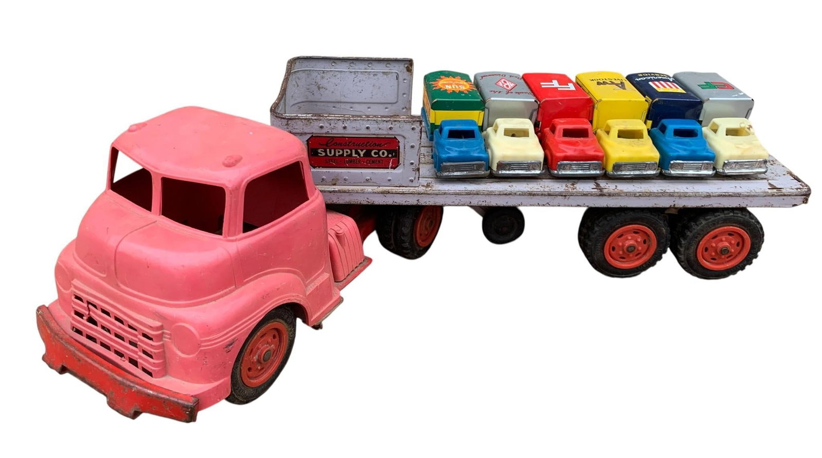7 pc Vintage Miniature Tin Litho Trucks & Art Deco Construction Truck & Trailer Toys: 6 4" tin litho composite cab trucks with rolling wheels and a large 23" metal and hard plastic Art Deco truck/trailer.