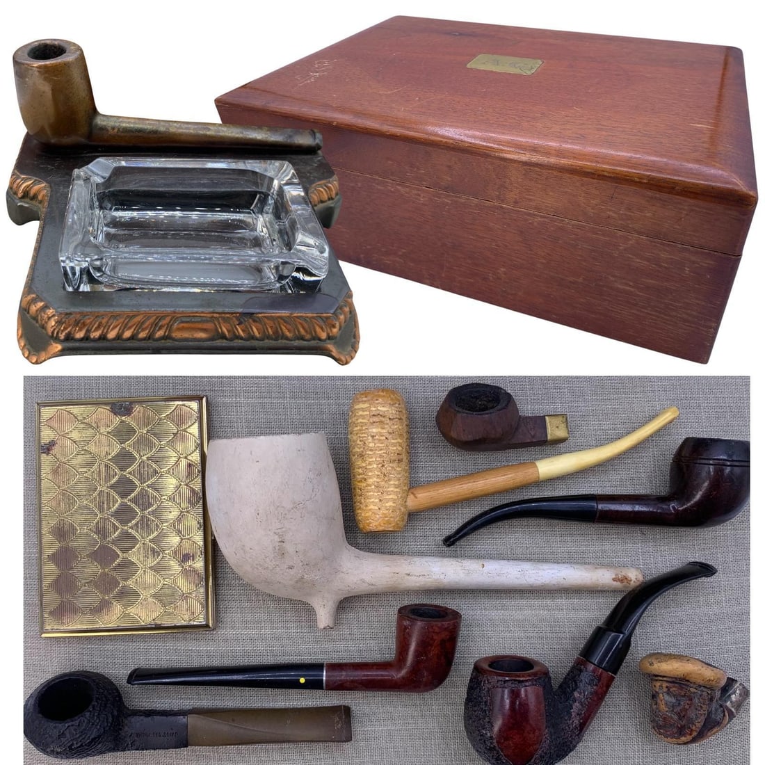 Mid Century Cigar Humidor, Bronze Pipe Ashtray and Antique to Vintage Tobacco Pipe Collection: * 11in34; x 7 1/2in34; x 4in34; wooden humidor with engraved brass plaque, DECO label on the felt lined base * Hefty bronze .Mason Masterpiece pipe tray with clear glass ashtray insert, 7in34; x 6 3/4
