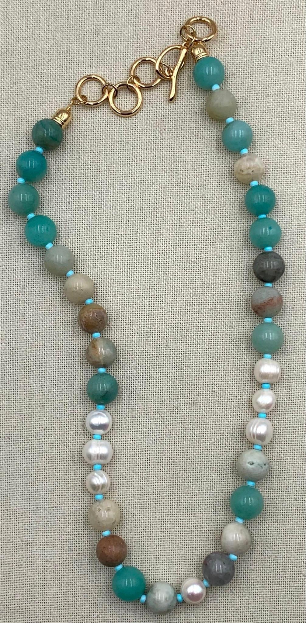 Lustrous Ringed Freshwater Pearl & Amazonite Necklace: 12-10mm freshwater pearls, 12.5mm polished Amazonite, gilded metal link toggle closure, 22" total length, can also be worn as a wrap bracelet.