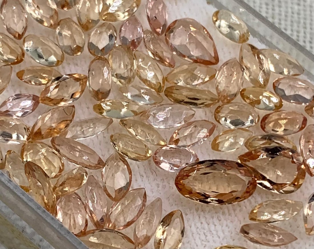 86 pc Mystic Topaz Jewelers Gemstone Collection: 8.5x5mm to 5x3mm oval, 7x5mm pear, 6x4mm marquise shaped Mystic Topaz gemstones in exceptional ombre sunset hues.