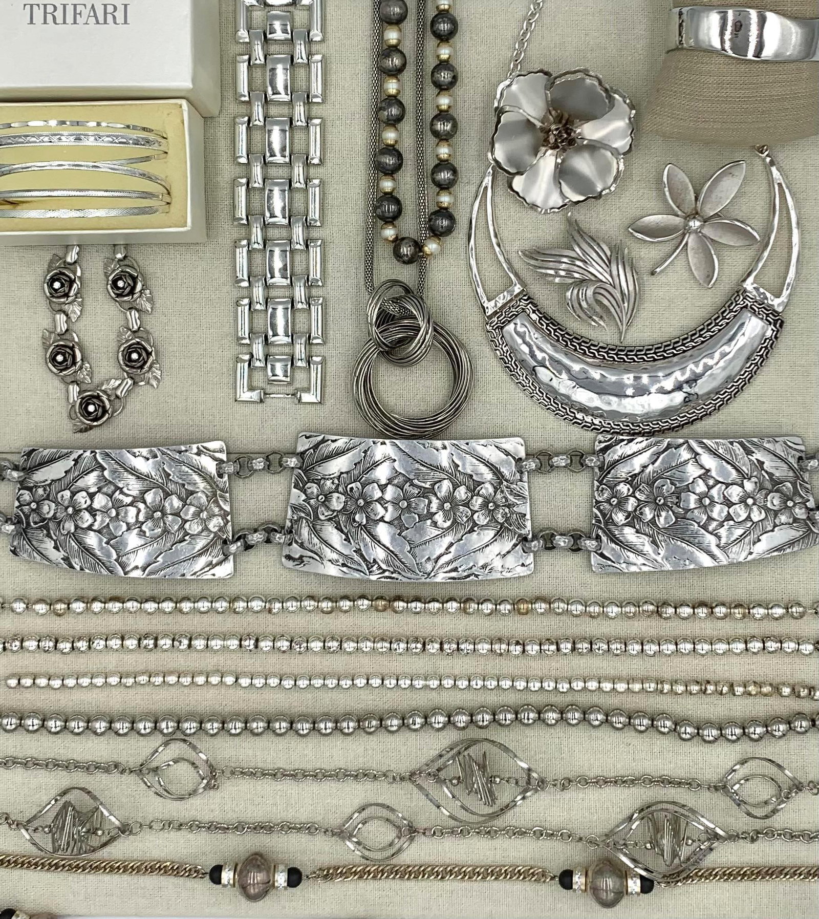Bold 22 pc Hammered Aluminum, Silver Tone Metal, Vintage Jewelry Collection: Outstanding hammered aluminum violet blossom belt, Trifari brooches, MCM wide link bracelet, luxe crescent moon collar necklace, pair of Ralph Lauren metal beads over metal chain necklaces and long Ho