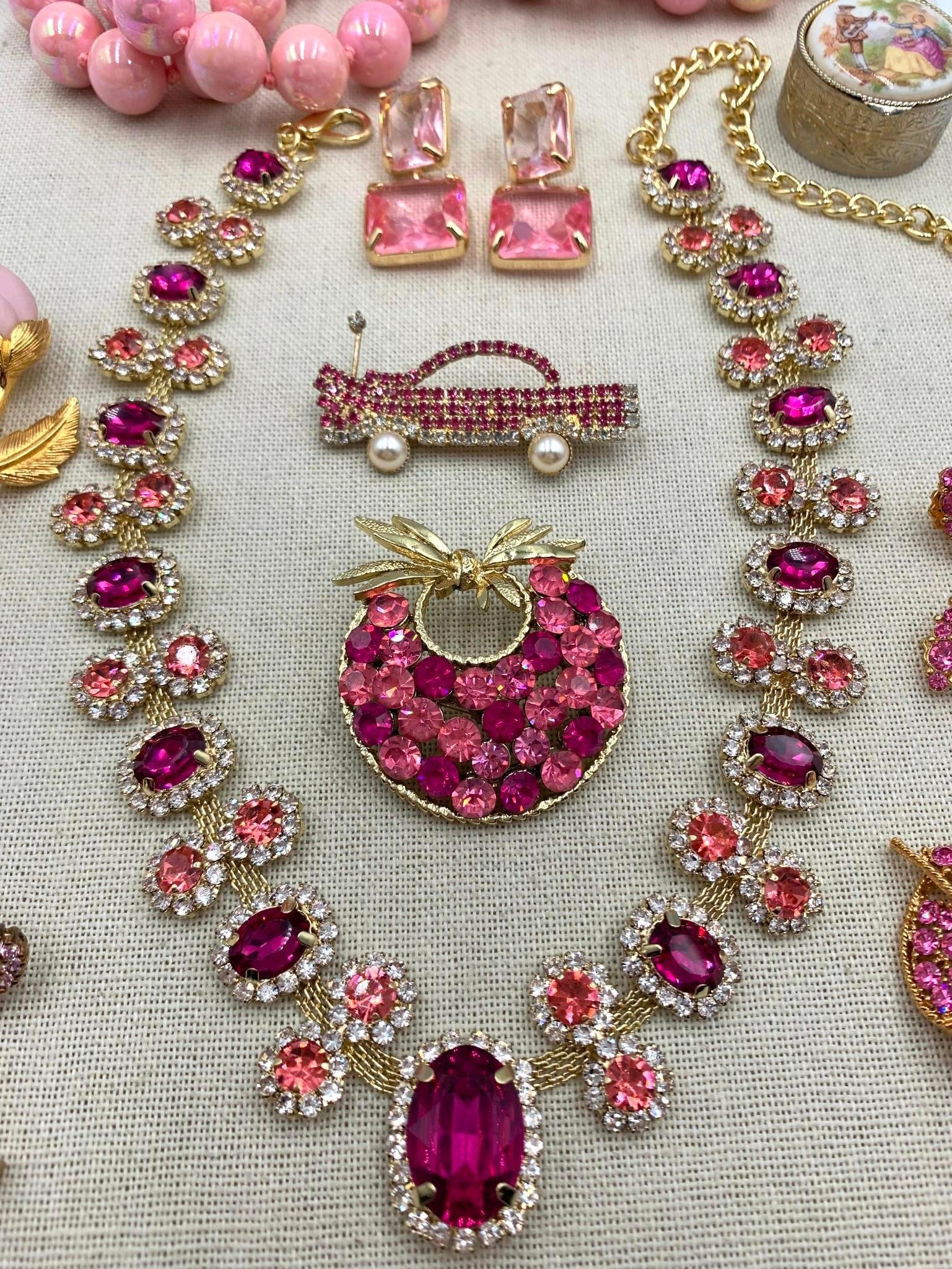 Luxe 10k Gold, Sterling, W Germany, Designer, Candy Pink CZ, Rhinestone, Diamond Jewelry Collection: * 10k hallmarked gold pendant with a created heart shaped pink Sapphire and Diamond accent, 15mm length * 925 hallmarked pink CZ heart and butterfly earrings, 1 1/2in34; length, pierced posts * Sensat