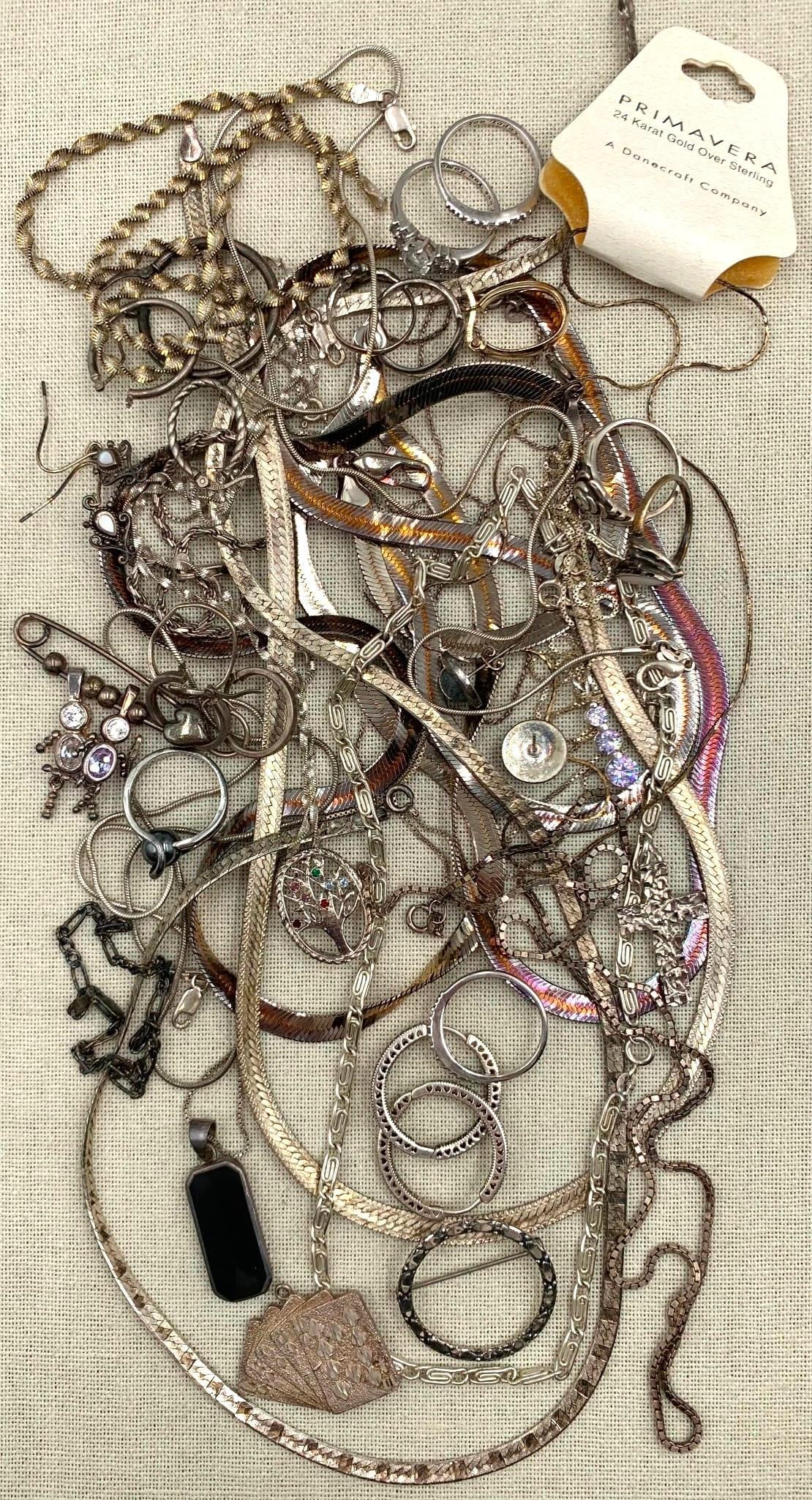 190 GRAMS of Sterling Silver Jewelry: 925 hallmarks, some earrings are singles, gemstones present in some of the pieces, a few closures are absent, one chain with Danecraft 22k over Sterling tag.