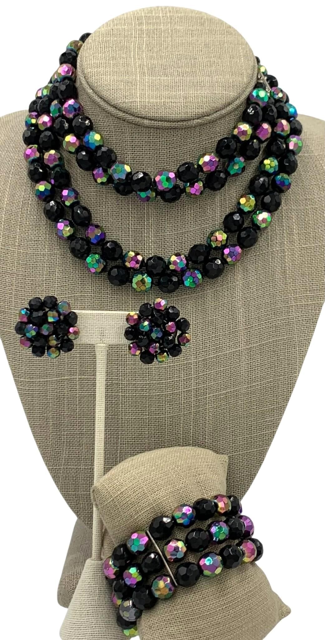17 pc Vintage Iridescent Plum Austrian Crystal Jewelry Collection: Superb double strand Mid Century made in Austria necklace/wrap bracelet/clip earring ensemble, assorted vintage statement necklaces, oversize clip earrings, MCM working wind up musical box key chain a