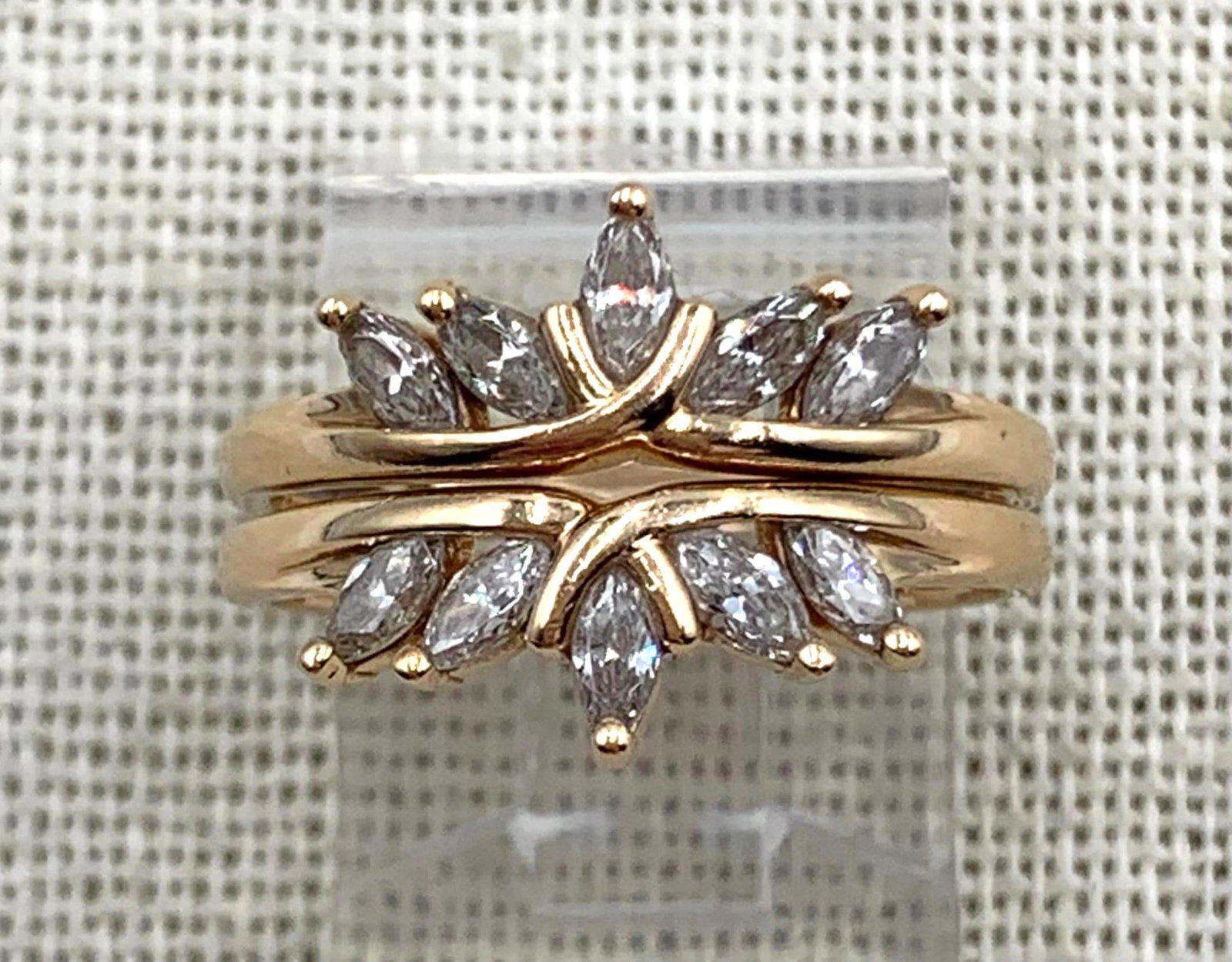 Pair 14k Yellow Gold Marquise Shaped CZ Solitaire Bracket Rings: 14k hallmarks, each 6.75 ring size, 3.87 combined gram weight, superb sparkle to the CZ gemstones.