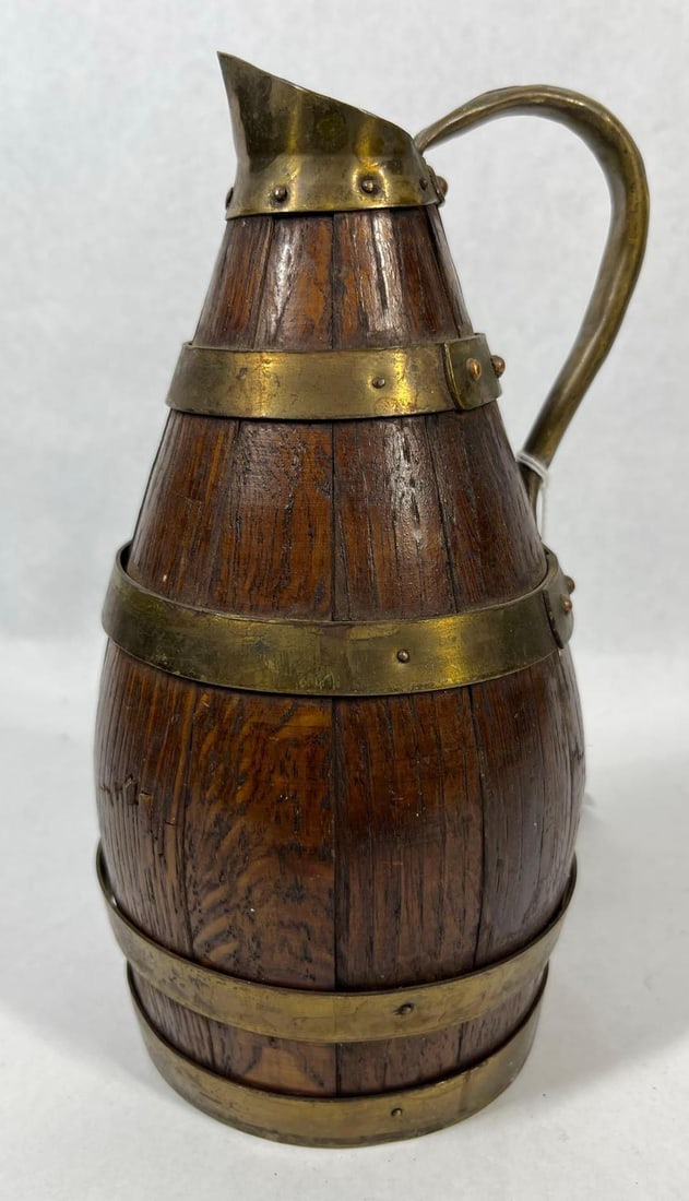 French Style Coopered Oak Cider Pitcher: 8 inches tall This vessel is a stave-constructed (coopered) pitcher, of a form traditionally used for serving cider or wine in France and other parts of Europe. The tapered body is composed of