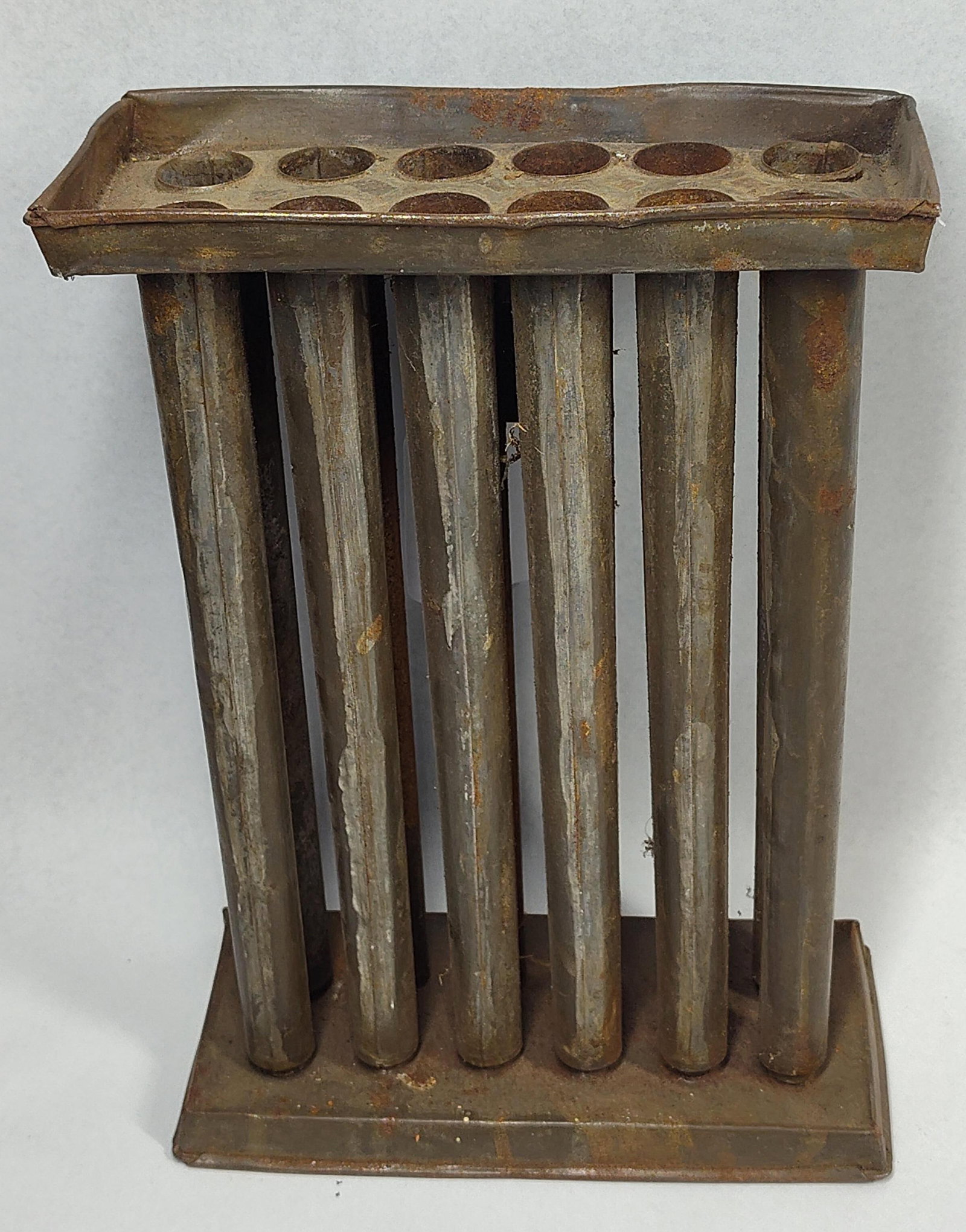 19th C. American 12-Tube Candle Mold: 10.5x7.5x3.5 This antique 12-tube candle mold is a representative example of 19th-century American utilitarian household hardware. The item is constructed from hand-soldered tinned sheet iron. The