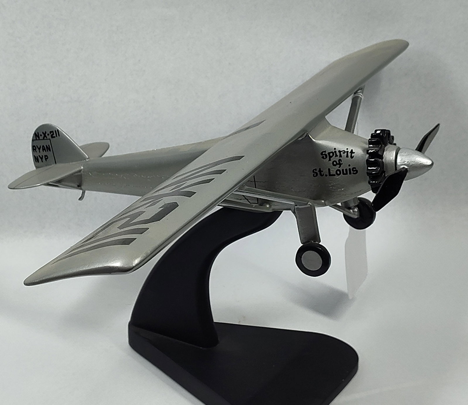 Ryan NYP Spirit of St. Louis Die-Cast: 20x12. This item is a collectible scale model of the Ryan NYP Spirit of St. Louis, the aircraft famously piloted by Charles Lindbergh. Based on visual characteristics and market consensus, this model
