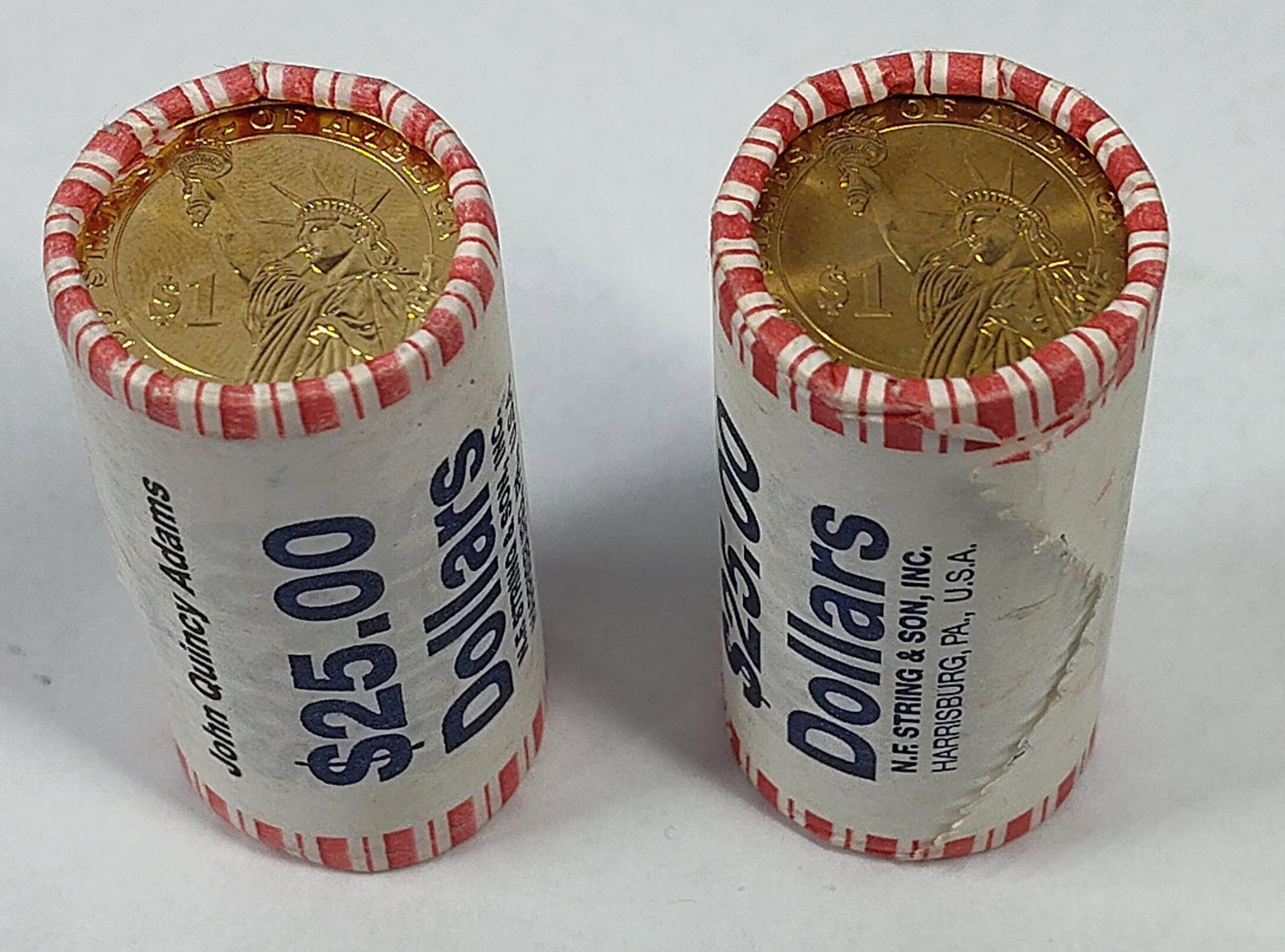 Pair 2008 Monroe & Adams $1 Coin Rolls: A pair of uncirculated bank rolls containing US Presidential $1 coins, with each roll holding twenty-five coins for a face value of $25.00. The manganese-brass clad copper coins are held in paper