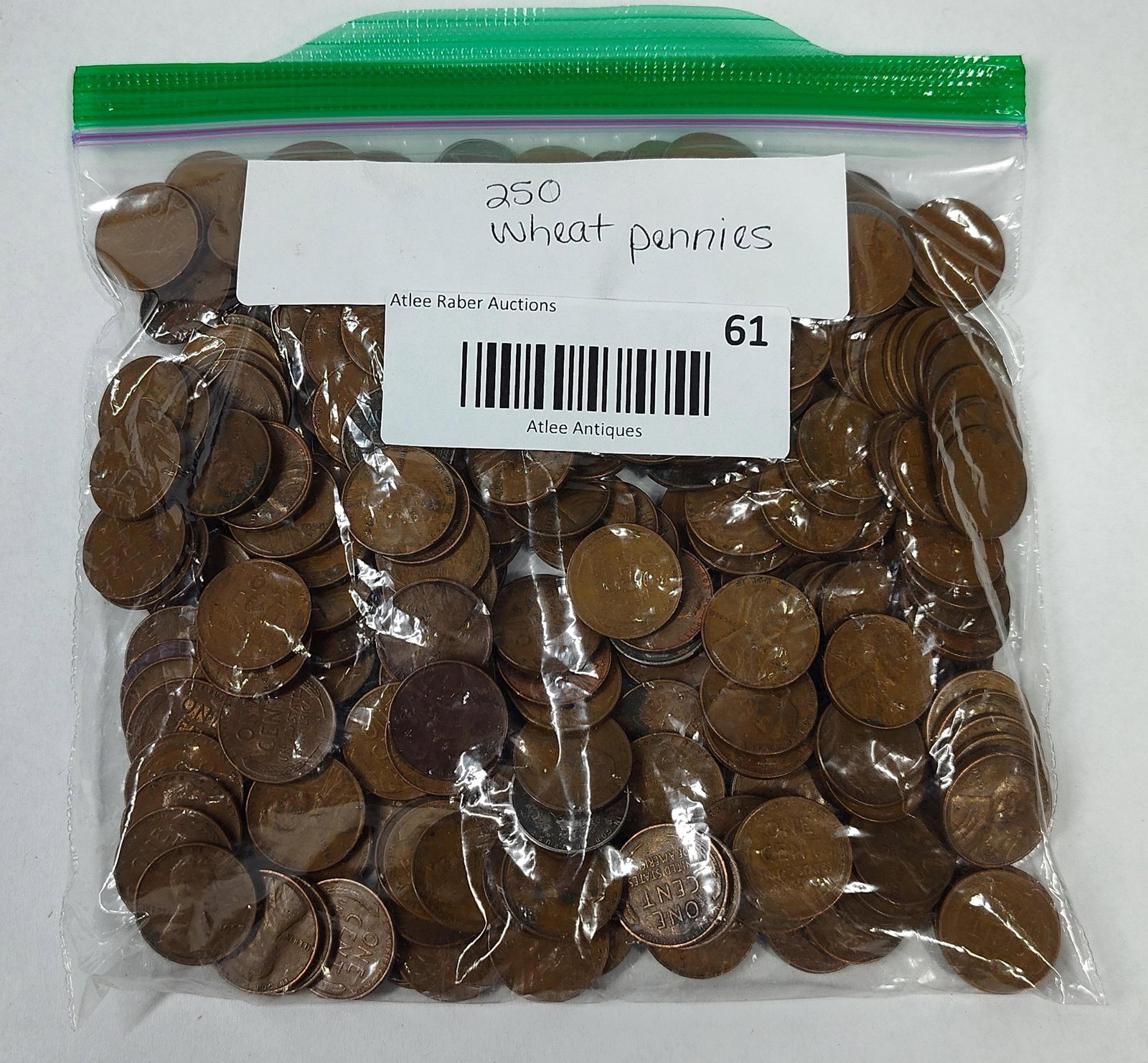 250 US Lincoln Wheat Cents: A collection of 250 US one-cent coins, commonly known as Lincoln Wheat cents. The obverse features the Lincoln obverse design, while the reverse displays the Wheat Ears reverse design. The coins are