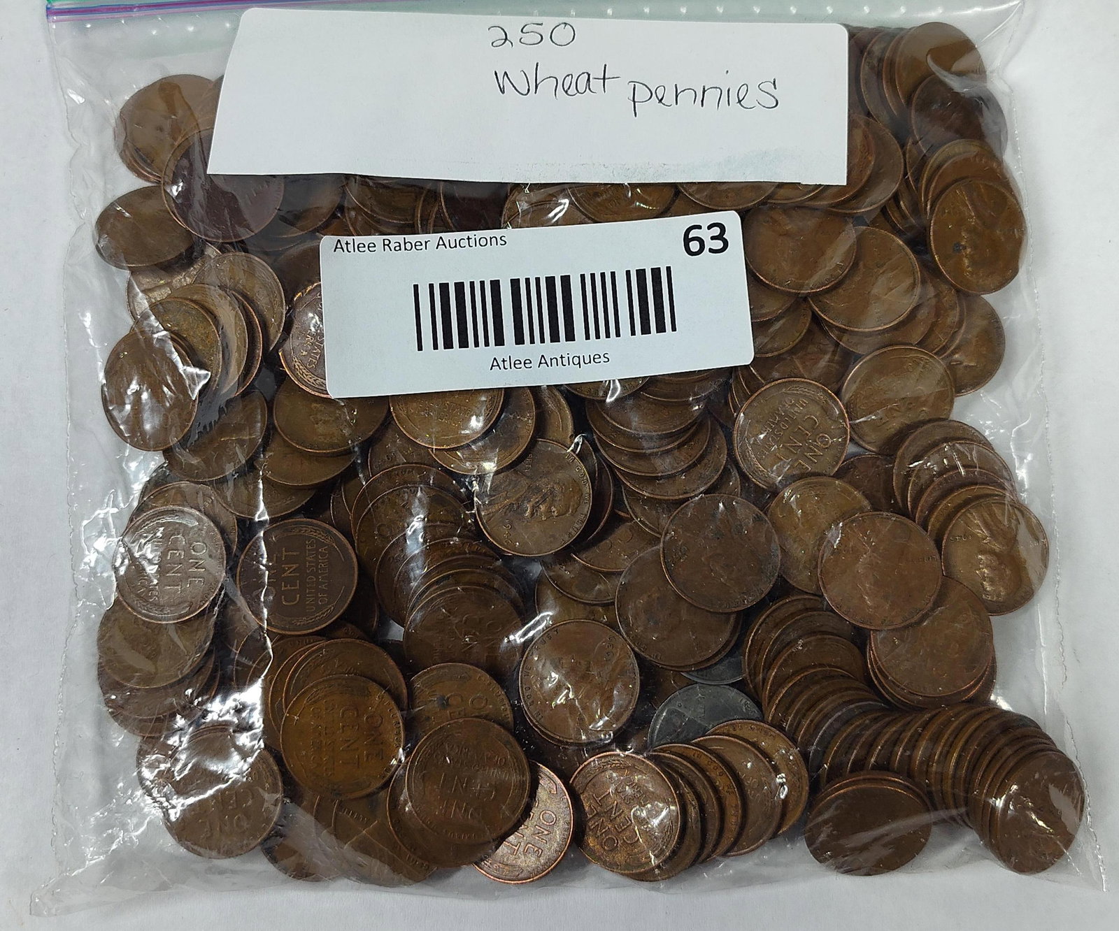 250 US Lincoln Wheat Cents: This lot consists of 250 United States one-cent coins, commonly referred to as Lincoln Wheat Cents, contained within a clear plastic bag. The coins feature the obverse design of Abraham Lincoln and
