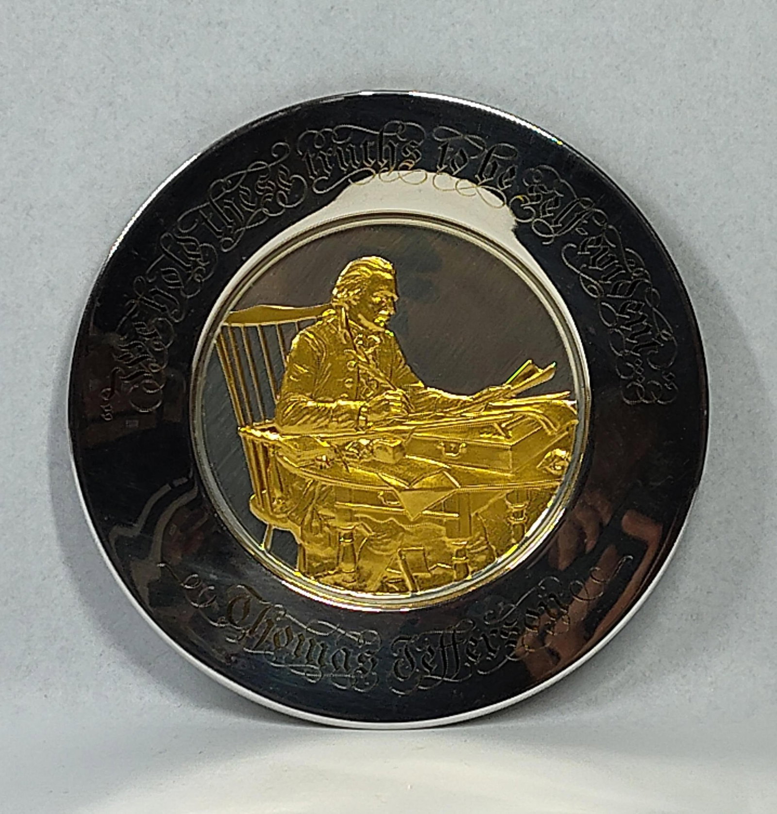 Franklin Mint Jefferson Str. Gold Plate: This 1973 Official Bicentennial Commemorative Plate was produced by the Franklin Mint for the Bicentennial Council of the Thirteen Original States. The plate is constructed of solid sterling silver an