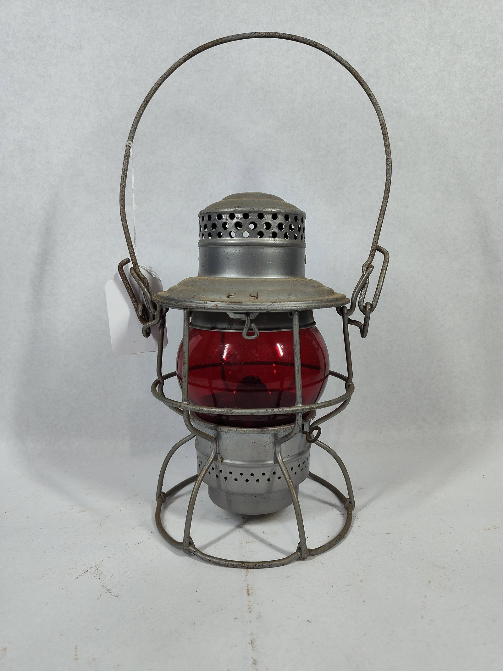 Adlake-Kero Canadian National Lantern: 9 in. This is an authentic Adlake-Kero railroad signal lantern manufactured by the Adams and Westlake Company. The lantern features a short-globe Kero design with a galvanized steel body and a