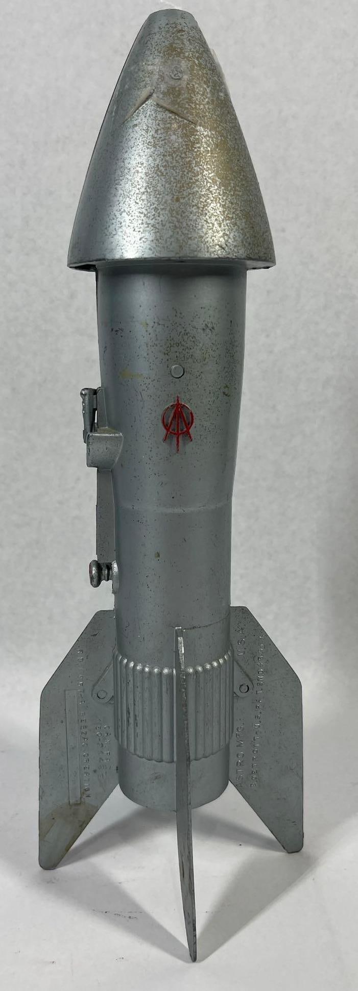 Astro Mfg Berzac Airlines Rocket Bank: 11 inches. This is a mid-century mechanical coin bank manufactured by the Astro Manufacturing Company of Detroit, Michigan. Designed by John Berzac and introduced circa 1957, the bank is constructed
