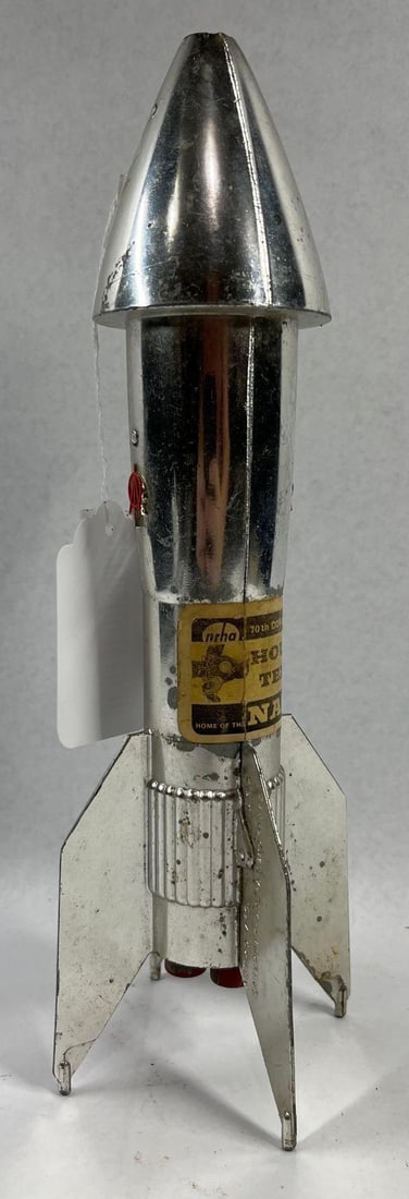 Astro Mfg. Berzac NASA Rocket Bank 1969: 11 inches. A vintage mechanical coin bank manufactured by Astro Mfg. Inc. and designed by John Berzac. The bank is constructed from chrome-plated die-cast metal and features a retro-futuristic rocket
