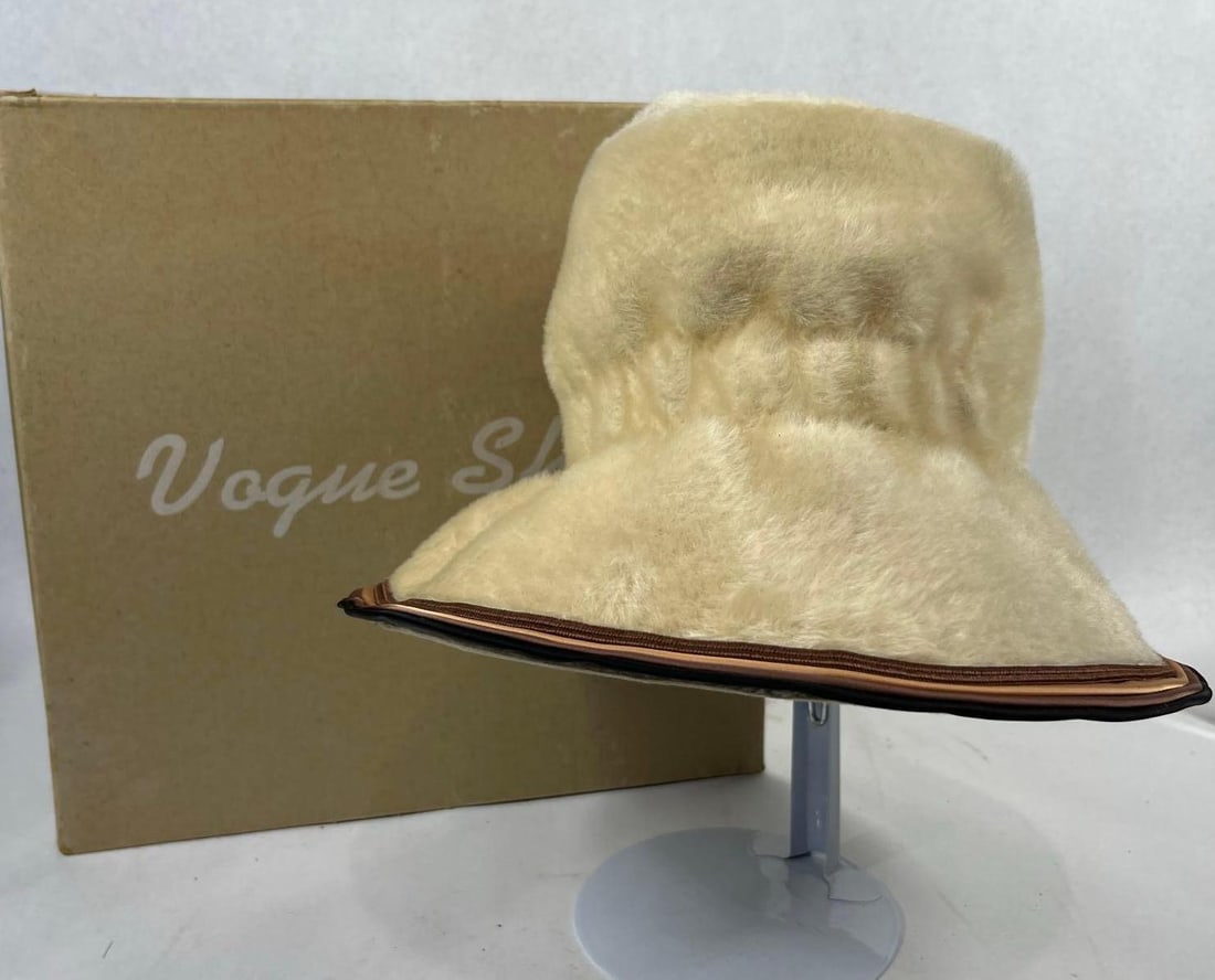 Sonni California Mohair Felt Bucket Hat: 7 in tall. A vintage mid-century women's flared-brim bucket hat by Sonni California. The hat is constructed from a cream-colored, long-pile felt with a soft, fuzzy texture, likely mohair or