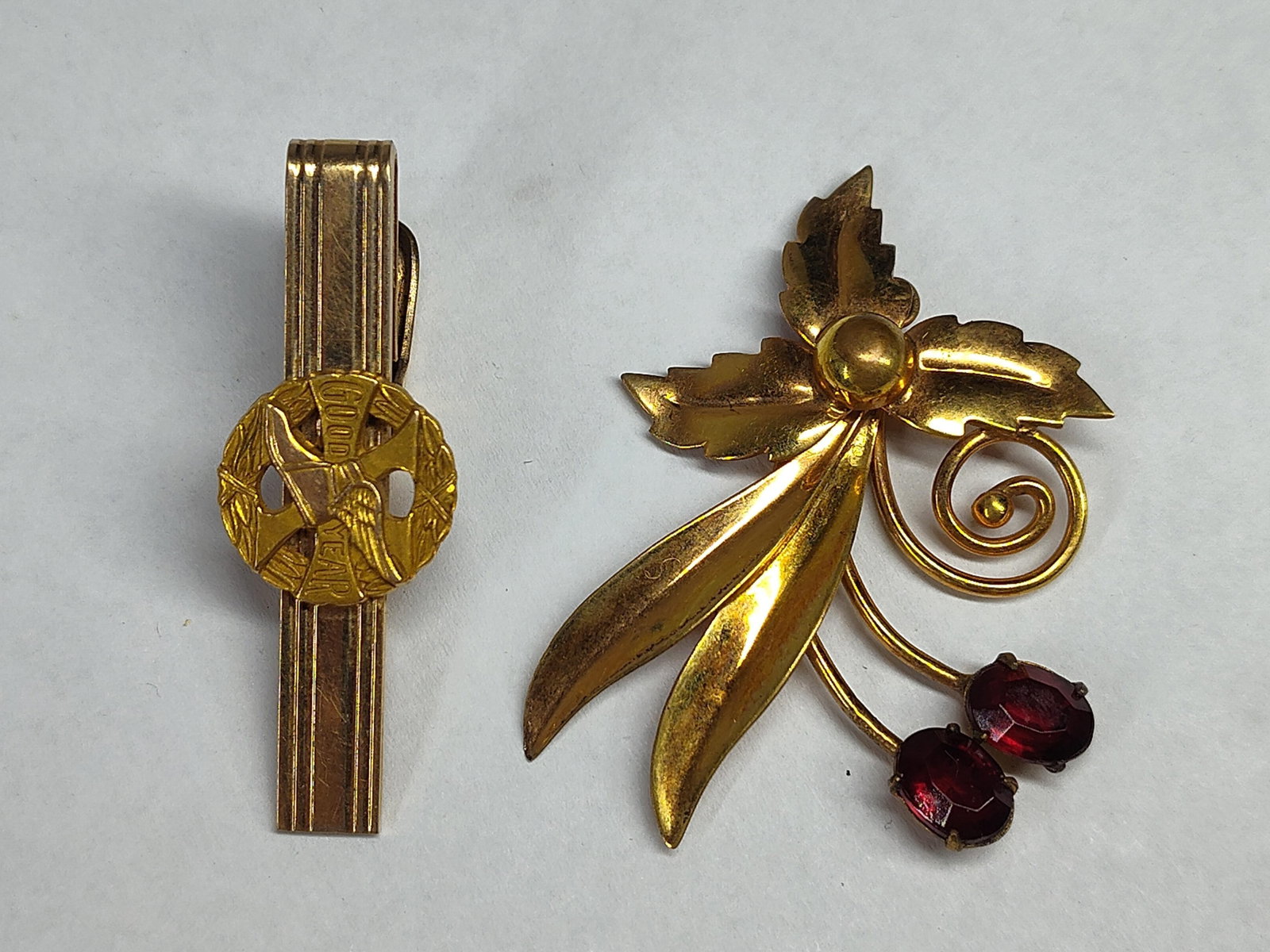 Goodyear Tie Clip & McRae Smith Brooch: This lot features two mid-century gold-filled jewelry items. The first item is a stylized floral spray brooch by manufacturer McRae and Smith, identified by the M&S mark on the reverse. The design