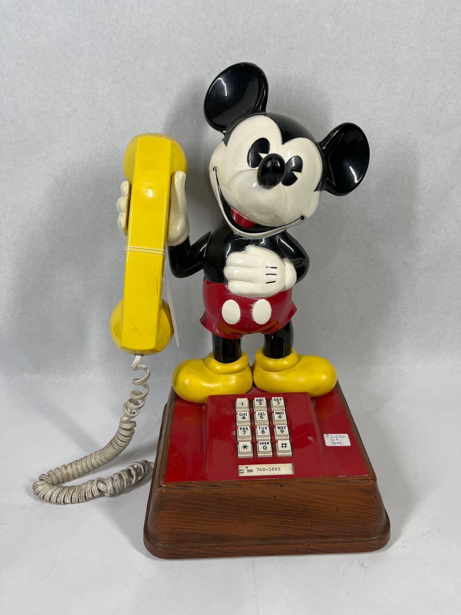 American Telecom Vtg Mickey Mouse Phone: 15 in tall. This vintage standing Mickey Mouse telephone was manufactured by the American Telecommunications Corporation (ATC) in El Monte, California. The unit features a three-dimensional molded