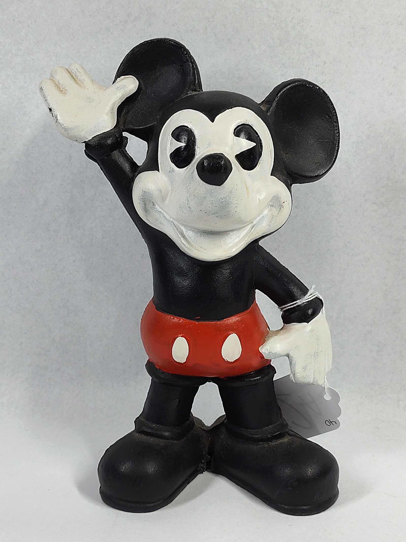 Mickey Mouse Pie-Eyed Vtg Still Bank: 9 in. tall. This character still bank is modeled after the early pie-eyed Mickey Mouse design from the Walt Disney Studio era. The figure is depicted in a standing pose with one hand waving and the
