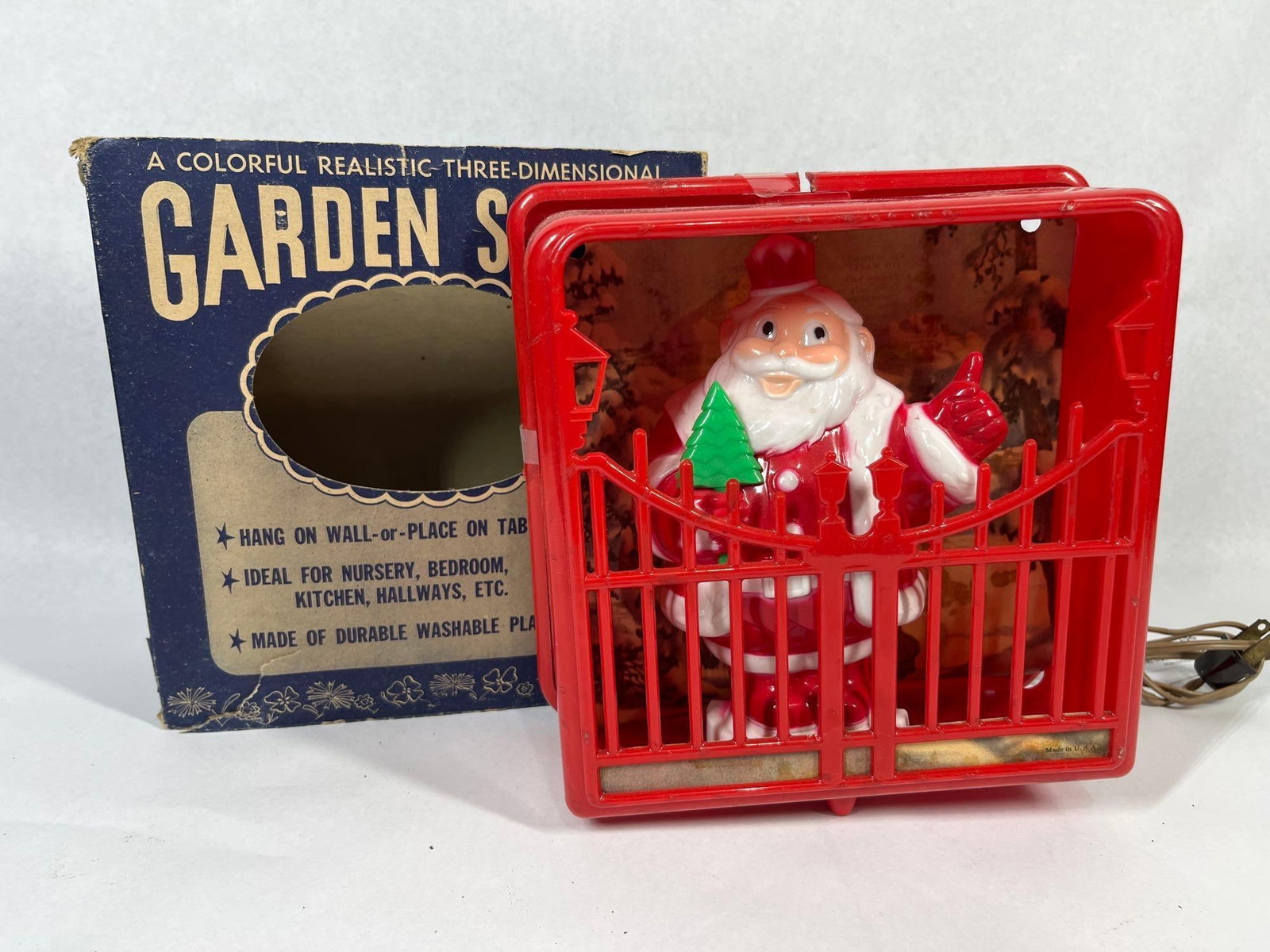 Harett-Gilmar Garden Scene Santa w/ Box: This vintage holiday decoration, produced by Harett-Gilmar of New York City, is titled Garden Scene and features a three-dimensional molded plastic figure of Santa Claus. The character is depicted in