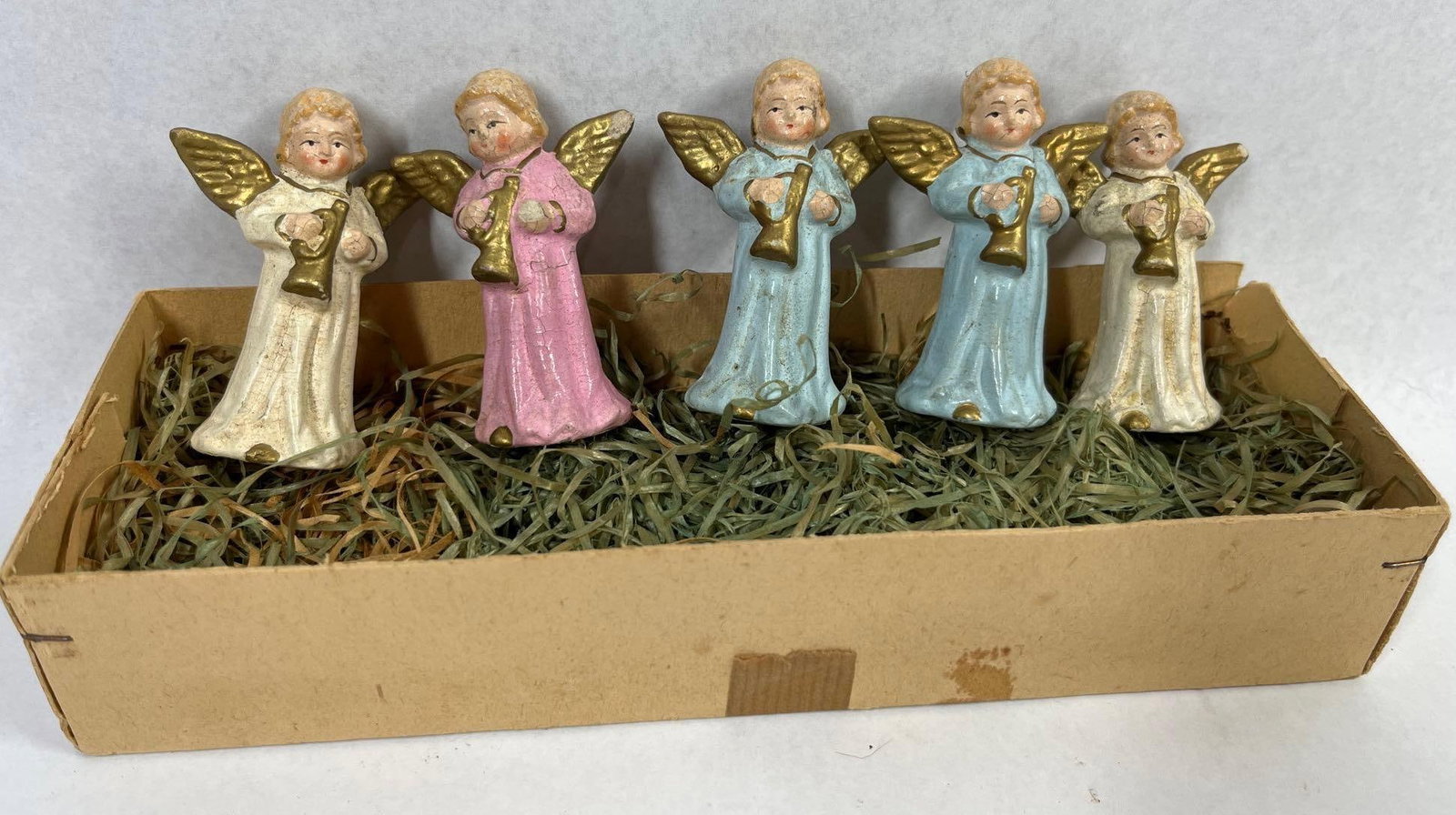 Set 5 US Zone Germany Angel Figurines: Each is 2.5 in. A set of five vintage molded angel figurines manufactured in the American-occupied zone of post-World War II Germany. The collection features angels in a choral or orchestral