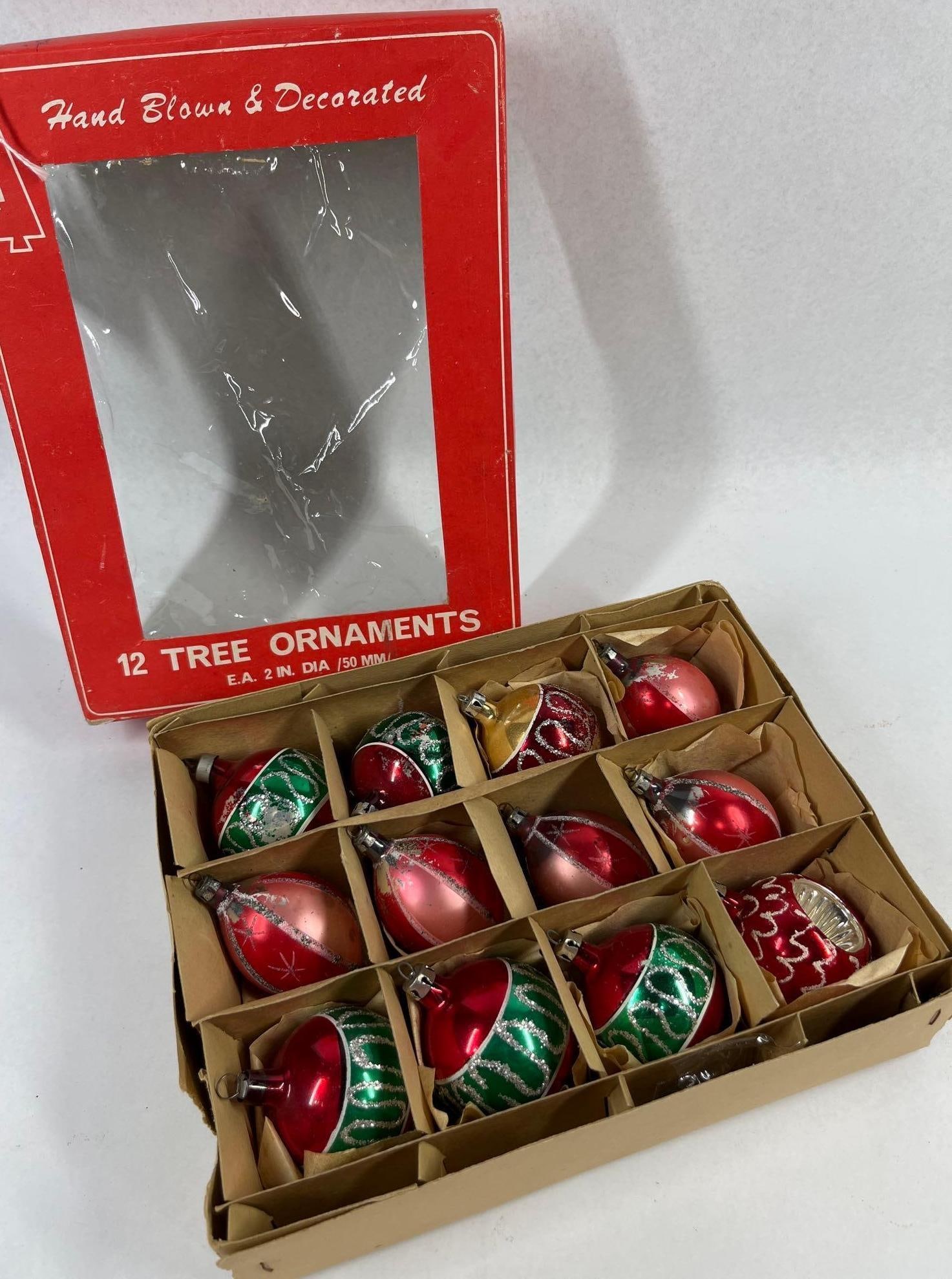 12 Hand-Blown Mercury Glass Ornaments: This set of twelve vintage Christmas tree ornaments is presented in its original retail box. The collection consists of hand-blown mercury glass ornaments in various colors including red, emerald gree