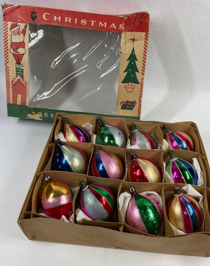 12 Vtg Mercury Glass Ornaments w/Box: Attributed to the Fantasia Brand, this set of twelve vintage holiday ornaments is crafted from hand-blown silvered mercury glass. The collection features a variety of teardrop and pointed ovoid