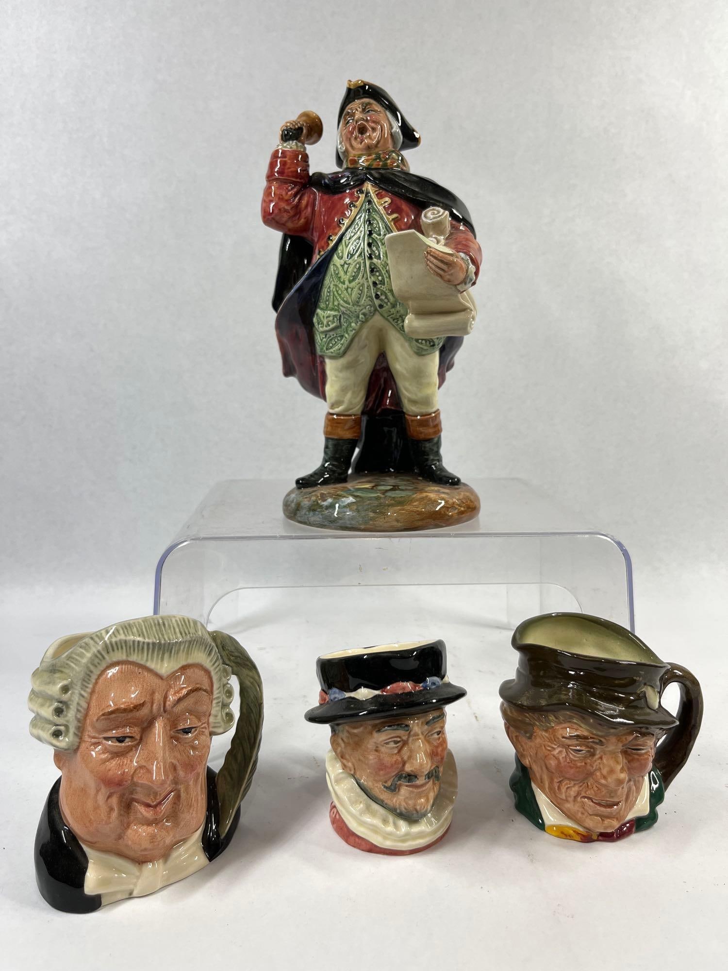 Royal Doulton Character Jugs & Figurine: This collection features four Royal Doulton glazed ceramic items, including one figurine and three character jugs of varying sizes. The set includes a full-length Town Crier figurine, a large