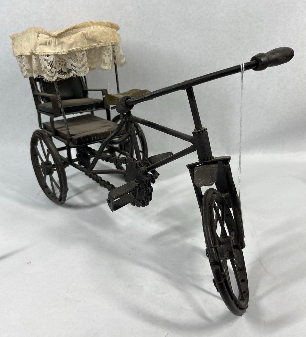 Vtg Metal & Wood Cycle Rickshaw Model: 18 in. A vintage hand-crafted miniature model of a cycle rickshaw, also known as a pedicab. The model is constructed with a dark-toned metal frame, likely iron or steel, featuring individual metal
