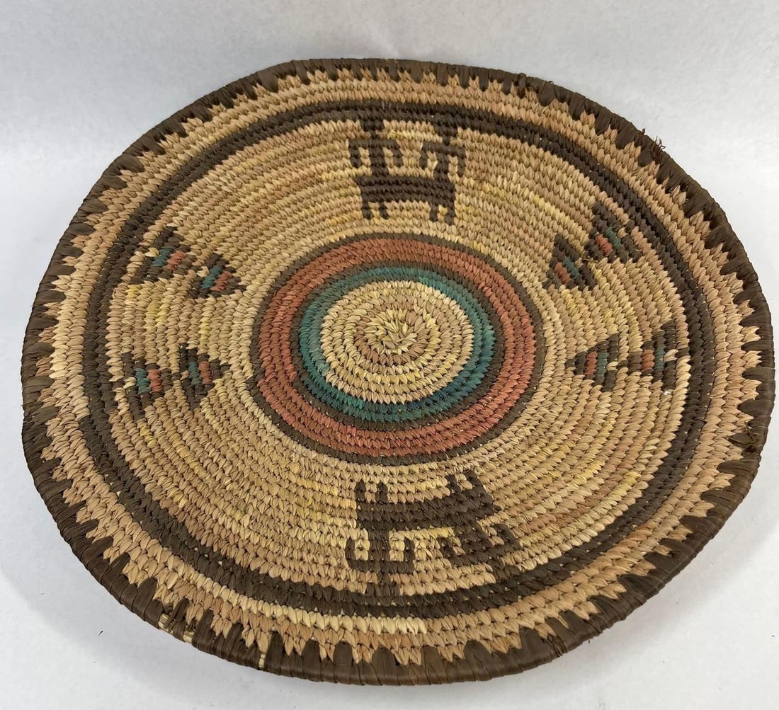 Hausa Tribal Coiled Grass Basket Tray: 13 inches. This coiled basketry tray is attributed to the Hausa people of northern Nigeria, characterized by its traditional West African weaving technique. The piece is constructed from natural and