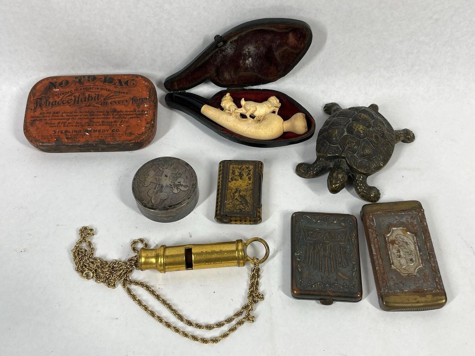 Antique & Vtg Tobacciana & Accessories: This group of antique and vintage personal and tobacciana items includes a variety of materials and forms. Featured is an orange lithographed tin from the Sterling Remedy Co. for No-To-Bac, with