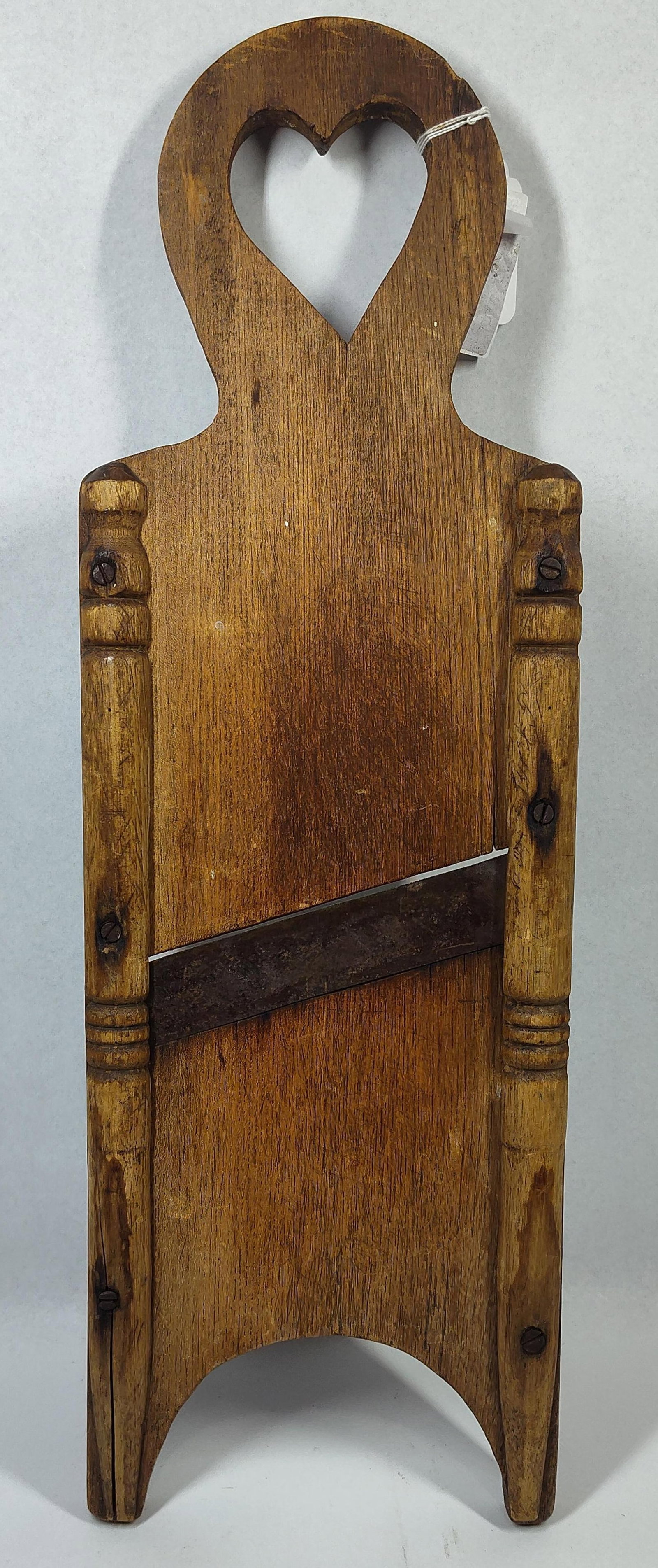 Primitive Hardwood Slaw Cutter w/ Heart: 24x8 This antique kitchen tool is a primitive cabbage shredder or slaw cutter, characteristic of late 19th to early 20th century Americana. The piece is crafted from a solid hardwood, likely oak,