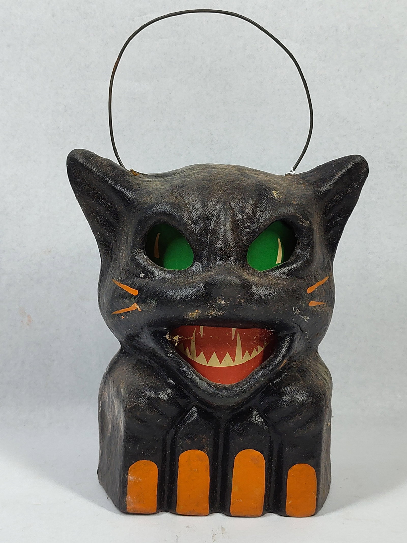 Seasons Gone By Halloween Cat Lantern: 7x6x5 This contemporary Halloween lantern was produced by Seasons Gone By and features a design executed in the primitive folk art style. The piece is constructed from a textured, molded composite