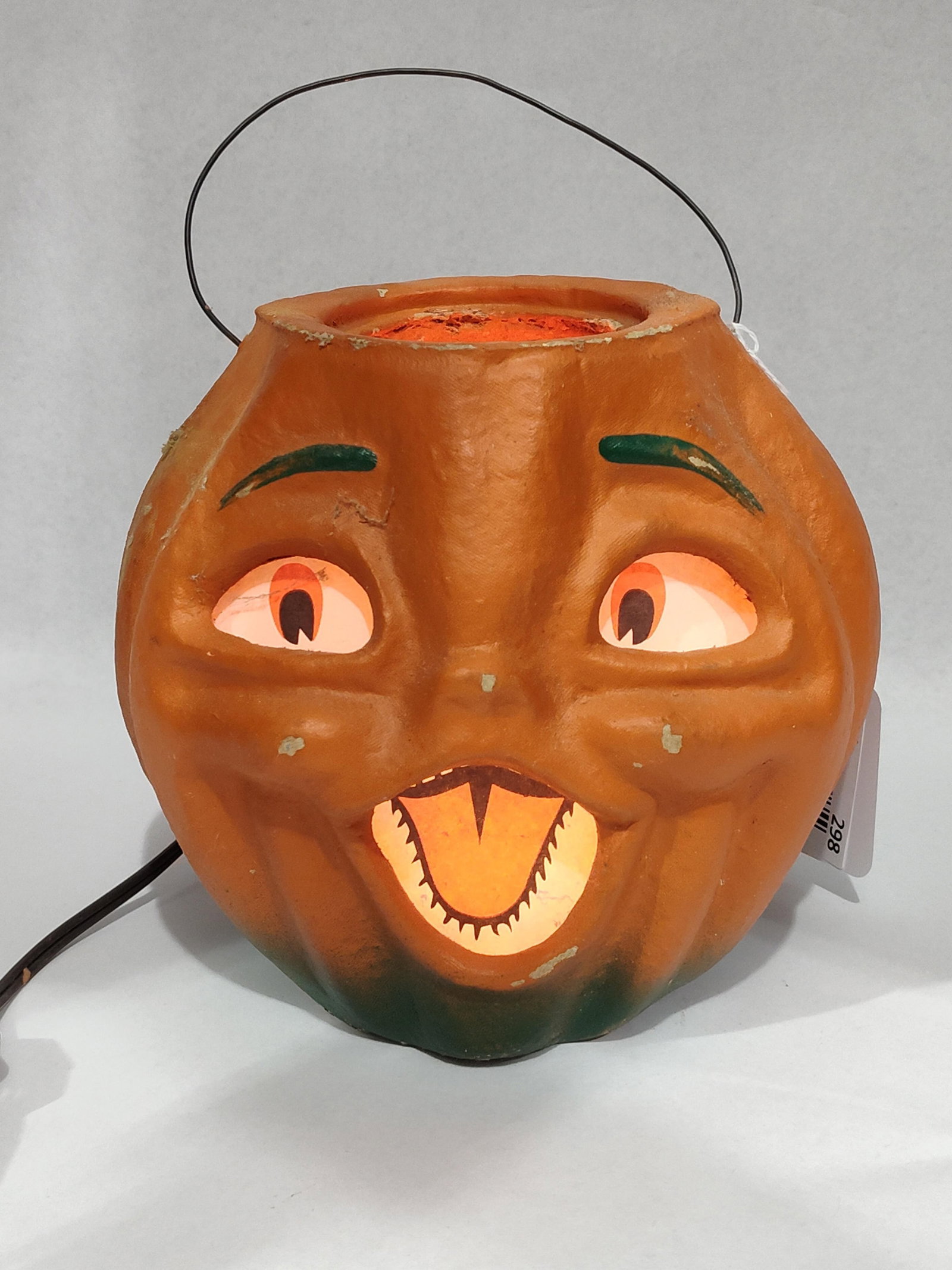 Seasons Gone By Spunky Pumpkin Lantern: 7x8x6. This vintage-style Halloween lantern is produced by Seasons Gone By, Inc., a company associated with the designs of Bethany Lowe. The item is an electrified jack-o-lantern designed in an