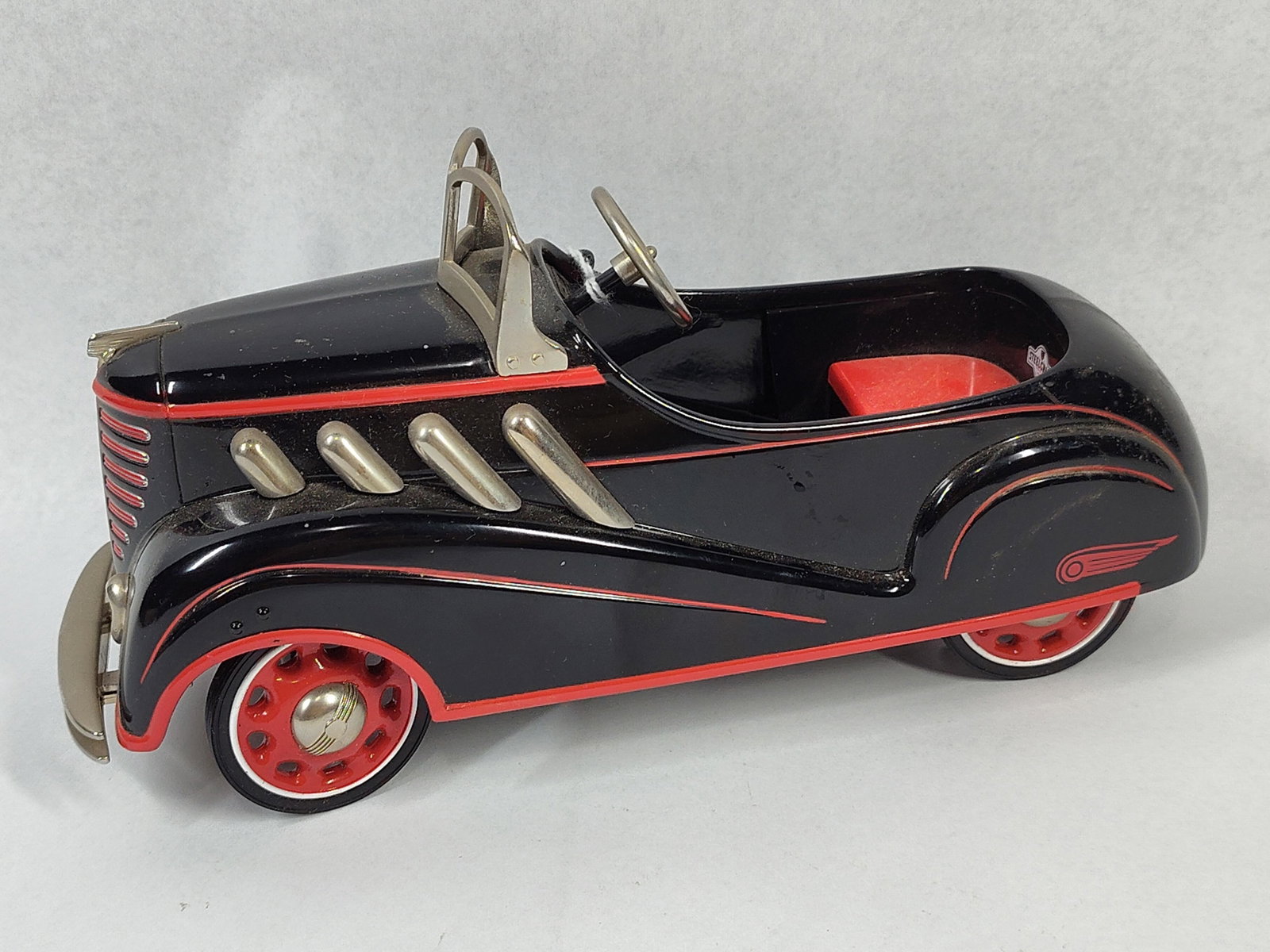 Hallmark 1937 Steelcraft Auburn Model: 8 inches. This item is a Hallmark Kiddie Car Classics scale model replica of a 1937 Murray Steelcraft Auburn pedal car. The model features die-cast metal construction with additional metal and