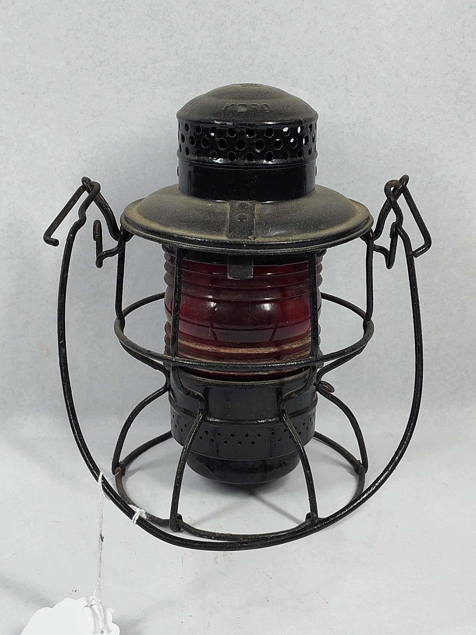 Adlake Kero Railroad Lantern, Red Globe: 9 inches. This is a mid-20th century railroad lantern manufactured by the Adams & Westlake Company. The lantern is the Kero model, which was specifically designed for kerosene fuel use. The