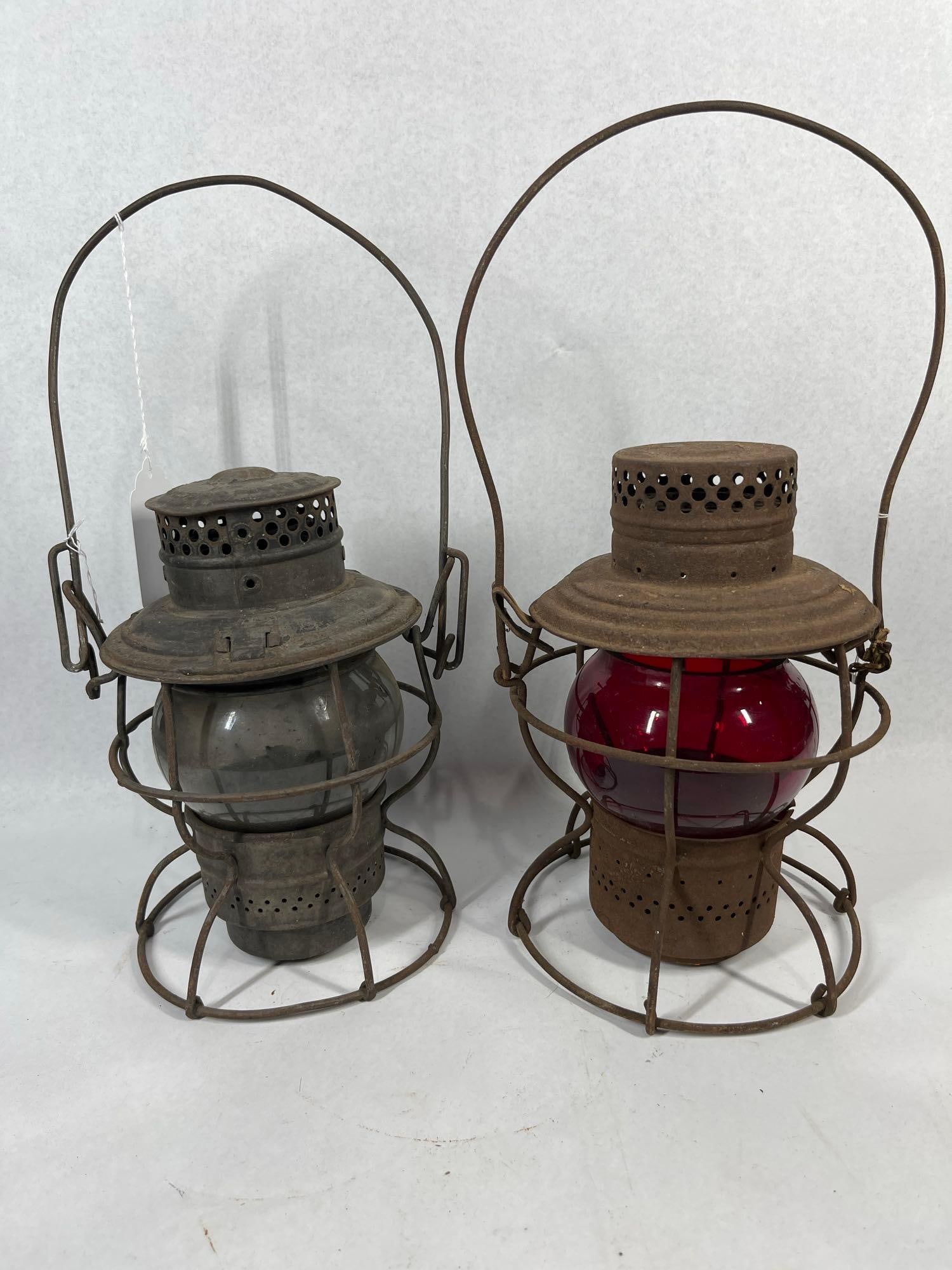 Dietz Vulcan & Vesta Railroad Lanterns: Each 9 in. This lot features two antique railroad lanterns manufactured by Dietz. The first is a Dietz Vulcan model with the shoulder stamped N.Y.C. & S.T. L. R.R., representing the New York, Chic