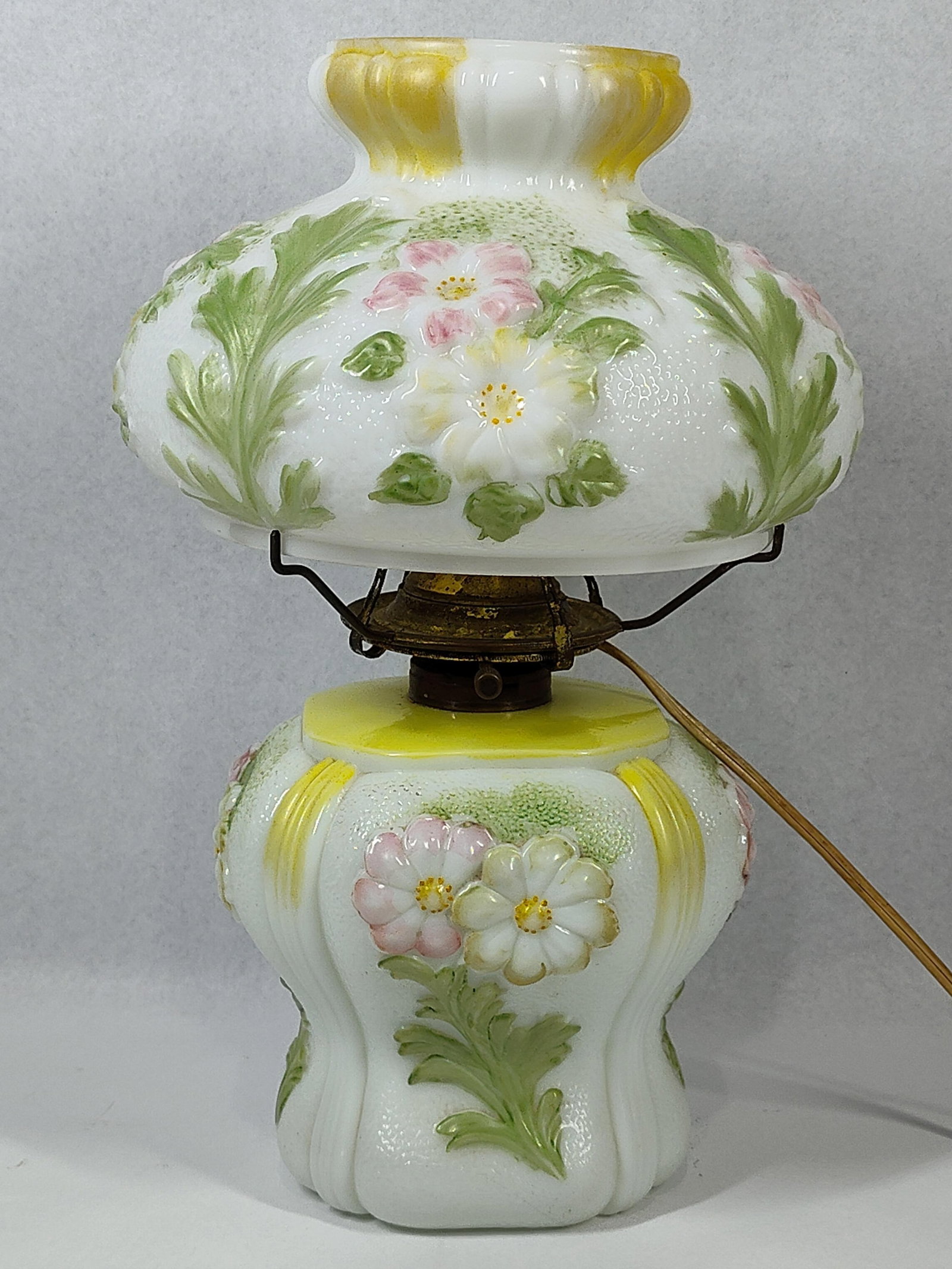 Victorian Milk Glass Gone w/ Wind Lamp: 15 in. A two-part Victorian style electric parlor lamp, often referred to as a Gone with the Wind lamp, constructed from molded opaque white milk glass. Both the globe shade and the bulbous base featu